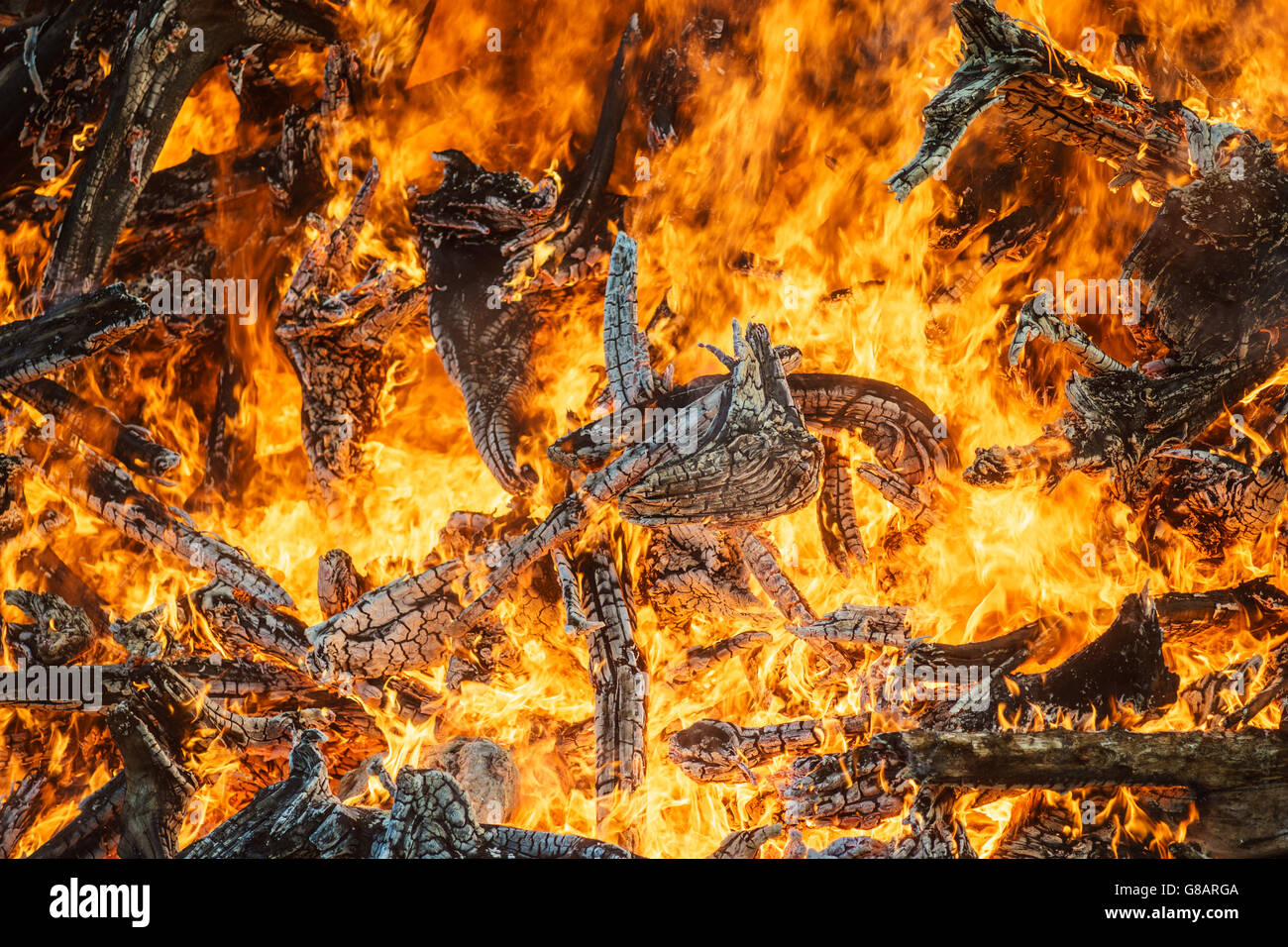 Great bonfire closeup, bright orange fire flames and firewood background Stock Photo
