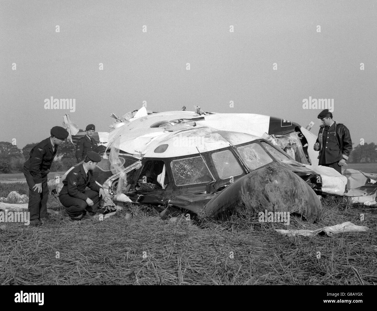 Police officers inspecting the wreckage of a Hawker Siddeley Trident jet airliner in a wheat field, near Felthorpe, Norfolk. It had crashed killing all four crew members. The Trident was on a proving flight before being delivered to BEA. It carried no passengers. It was the first time a Trident has been involved in a crash. Stock Photo