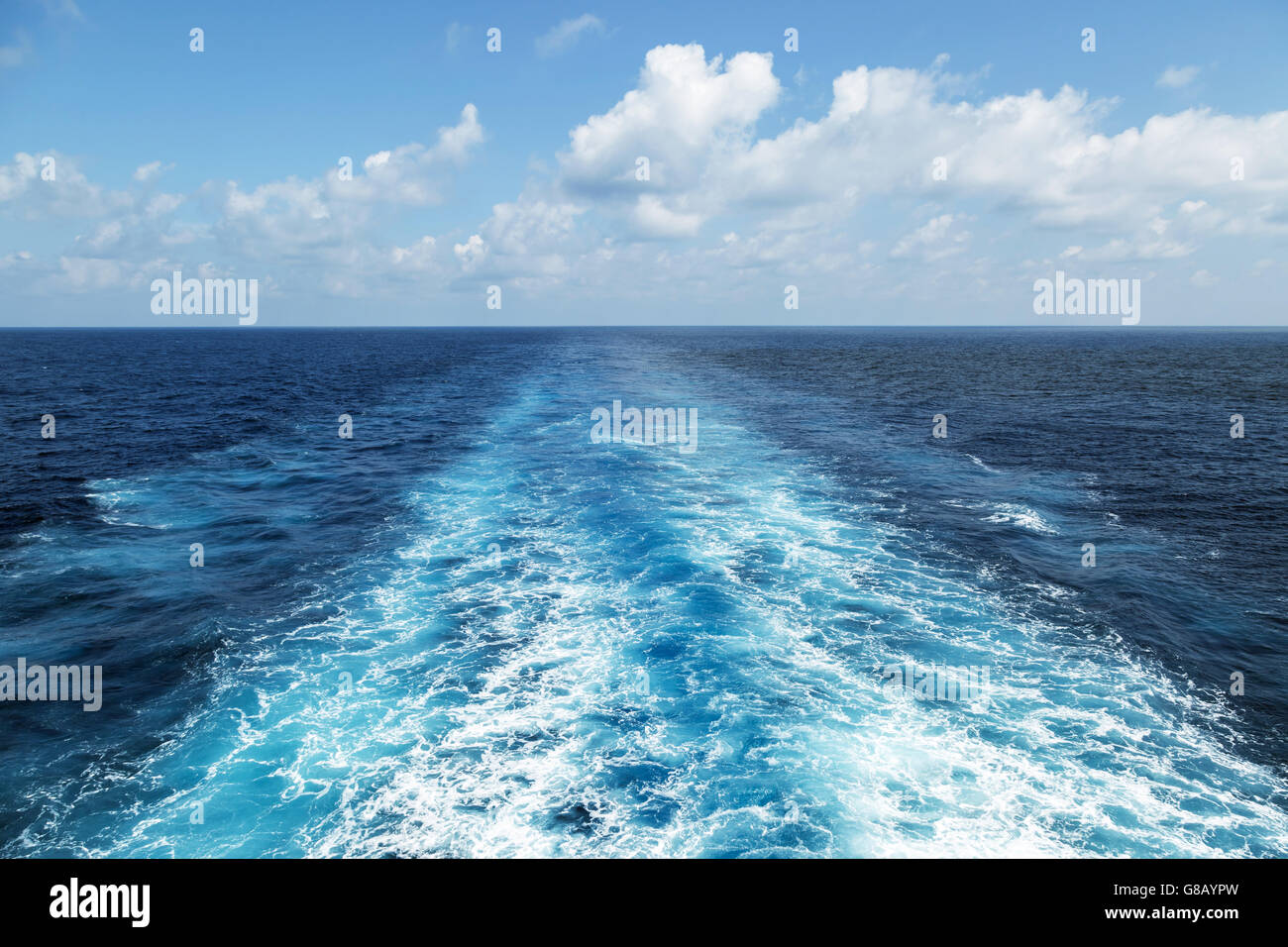 Wake on the blue sea surface - background Stock Photo - Alamy