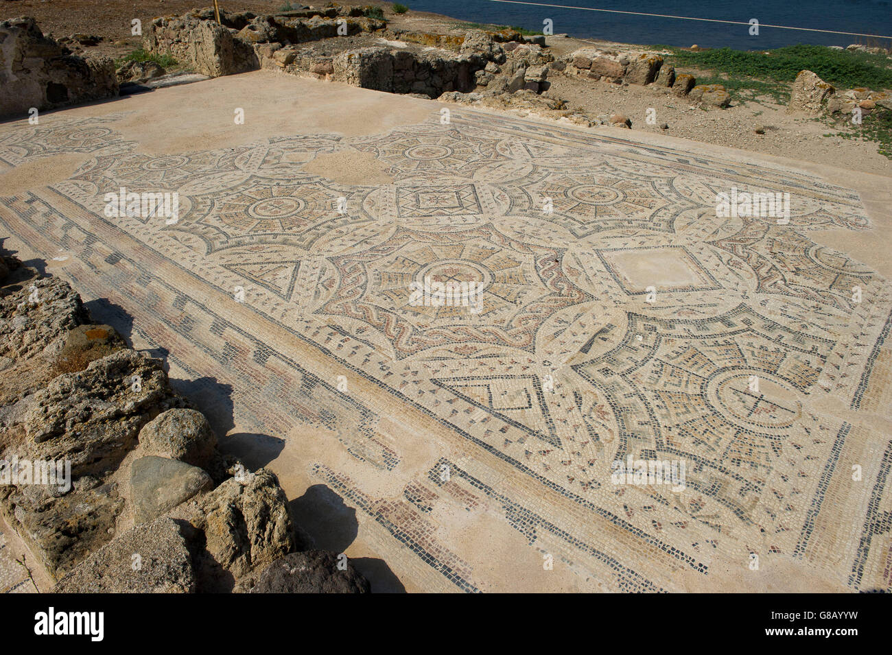 Amphitheatre of the ancient Nora archaeological site, near Pula, Sardinia, Italy Stock Photo