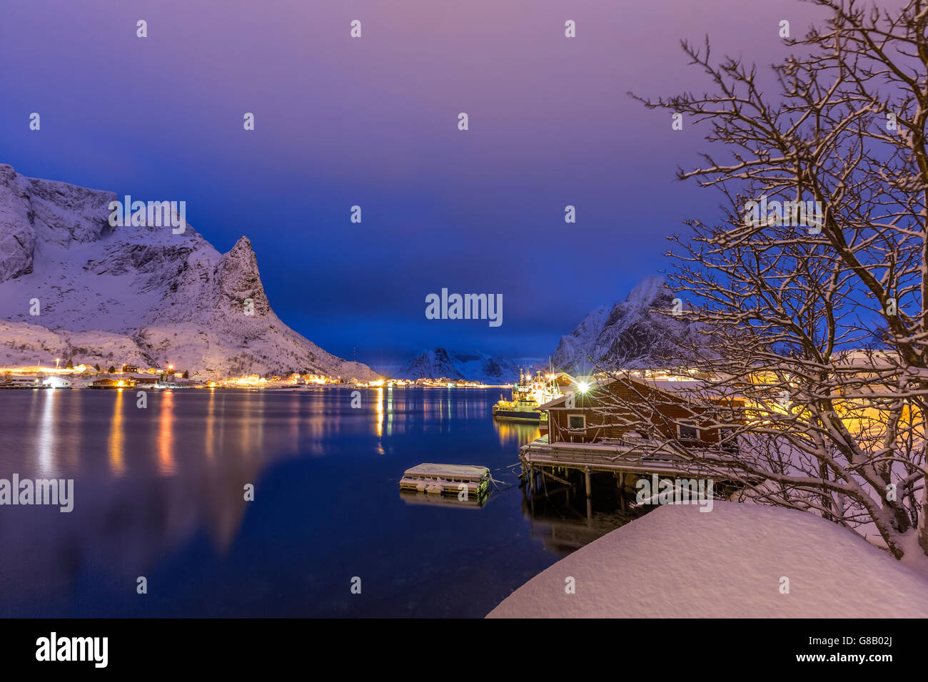 Snowy Peaks Reflected In The Cold Sea At Dusk Reine Lofoten Islands