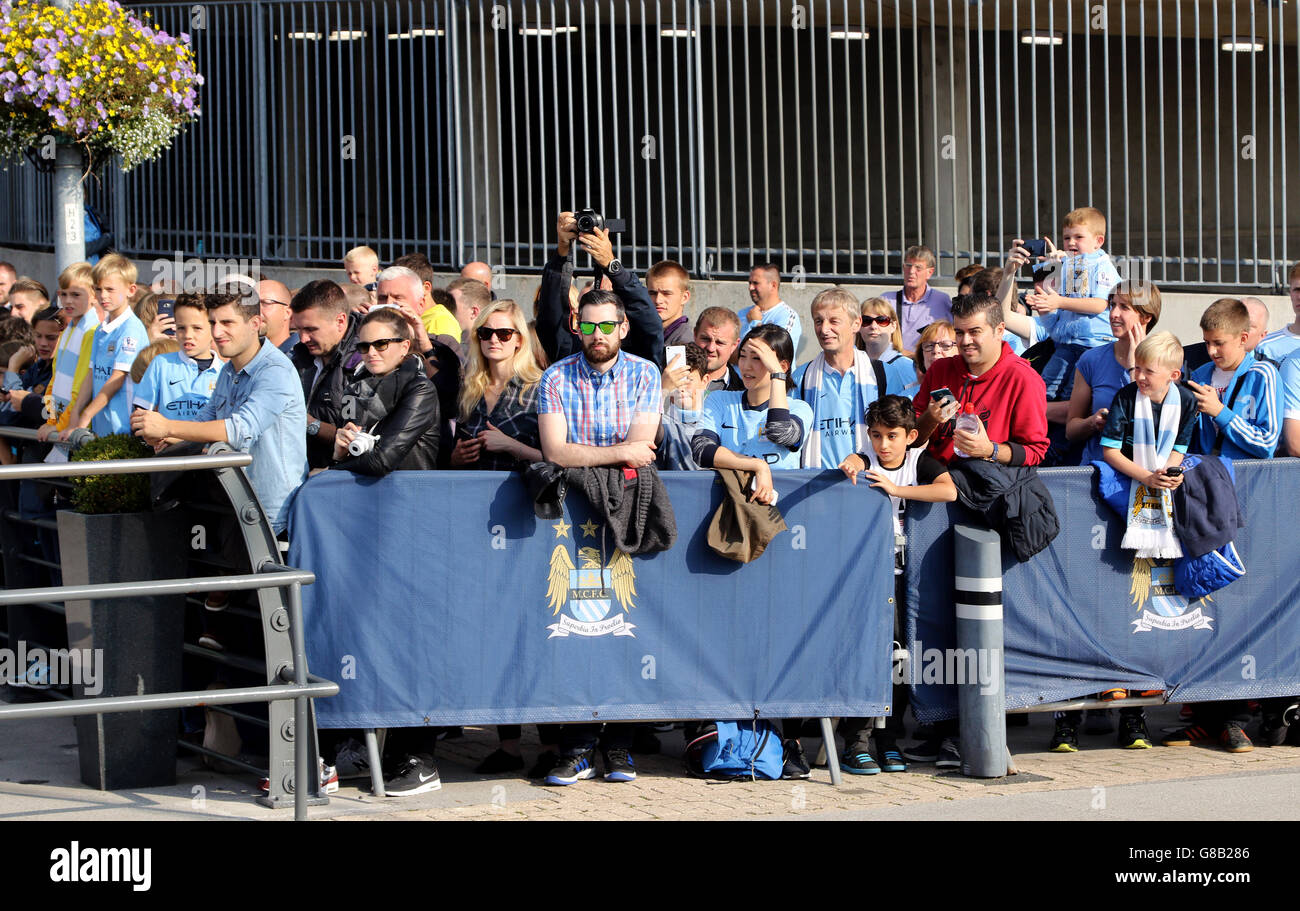 Soccer - Barclays Premier League - Manchester City v West Ham United - Etihad Stadium. Fans outside the Etihad Stadium Stock Photo