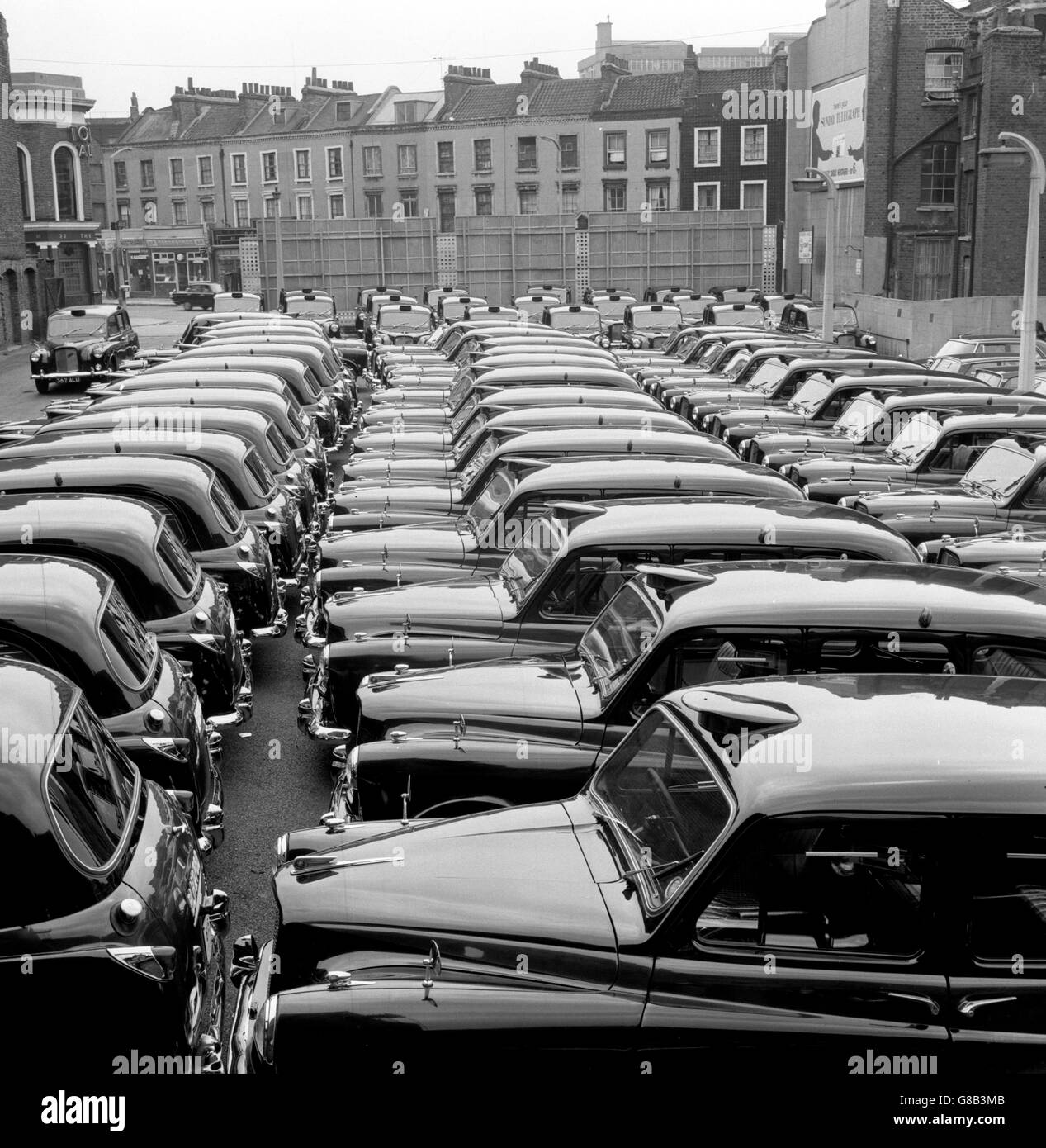 Taxis parked in silent ranks at Yorkway Motors, Caledonian Road, King's Cross, London. The 11,000 taxi drivers had decided to take a 'co-ordinated rest day' to draw the Government's attention to their case against mini cabs. Stock Photo