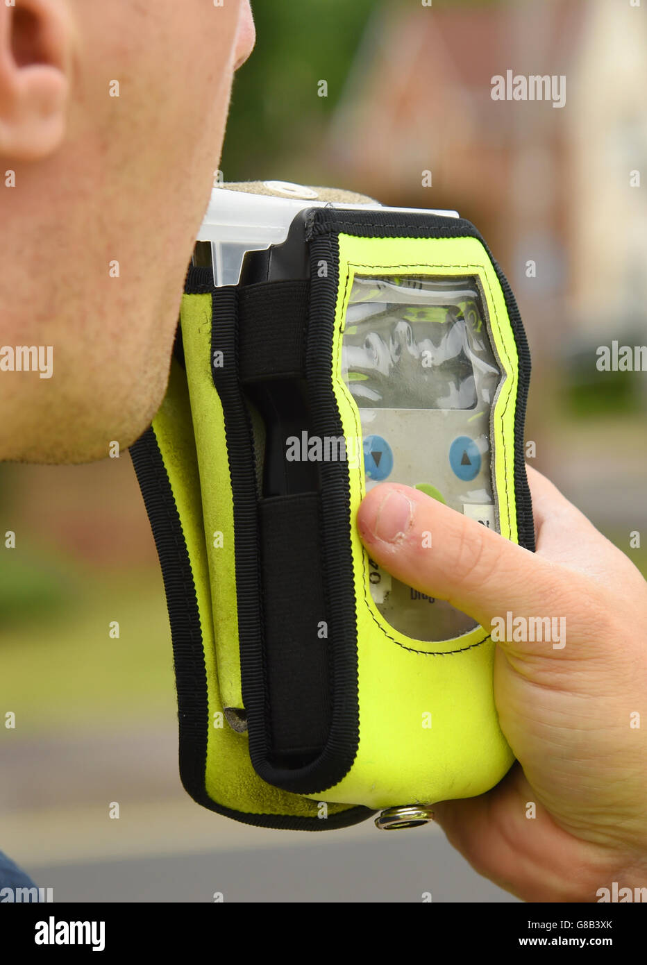 a driver is given a roadside alcohol breath test Stock Photo