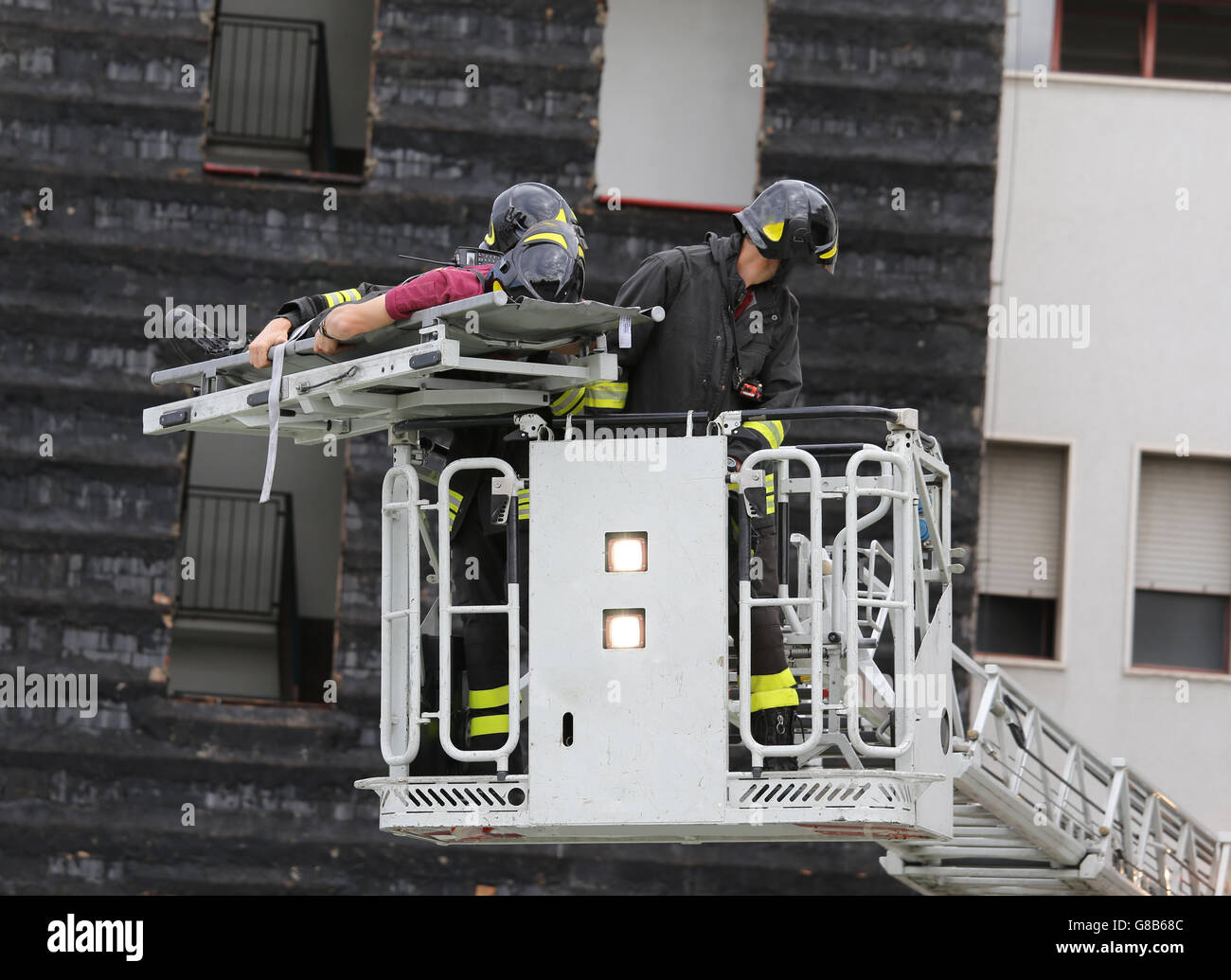 firefighters in the fire truck basket during the practice of training