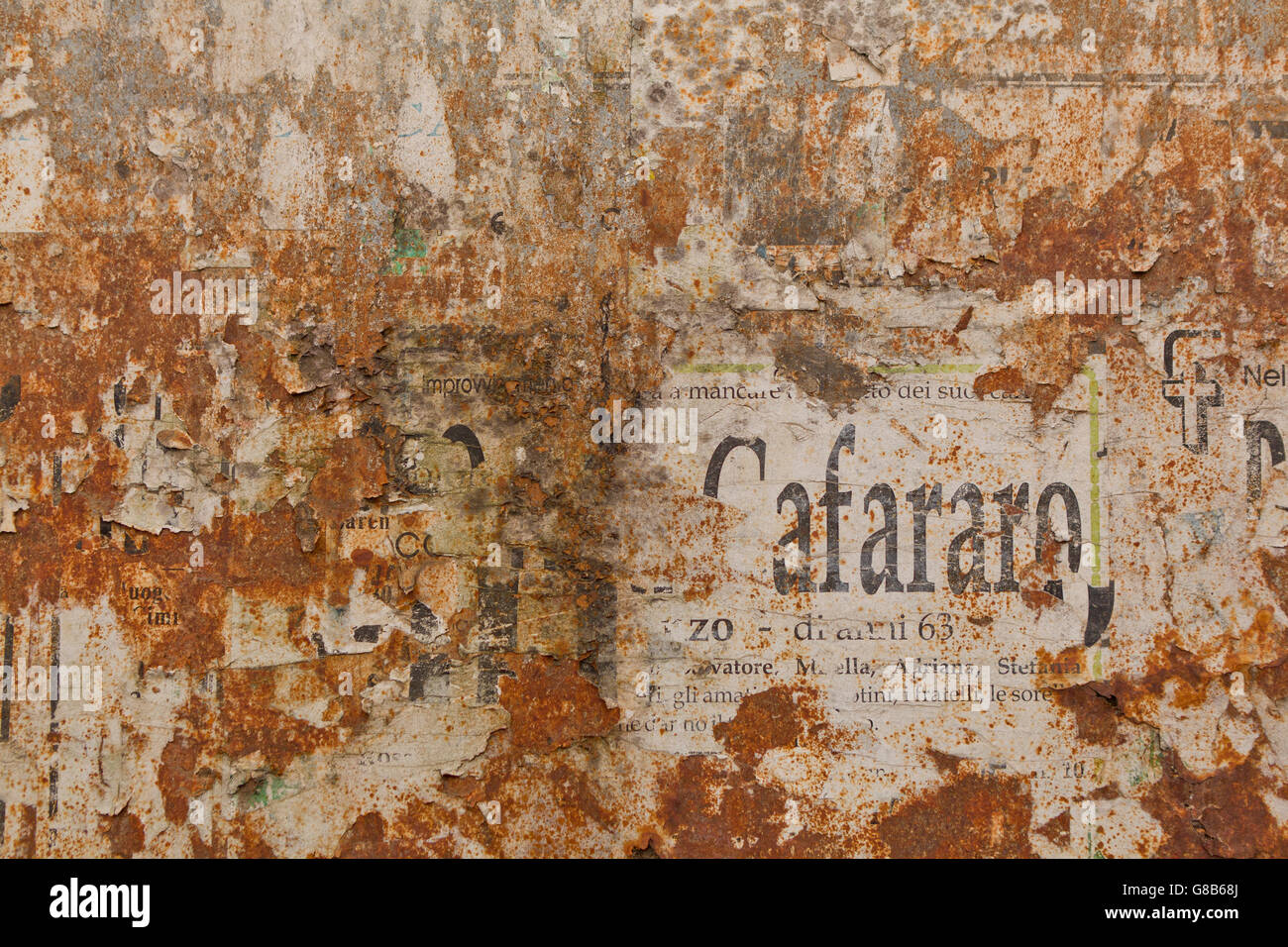 Old stone wall with peeling paper advertisements, Sorrento, Italy Stock  Photo - Alamy