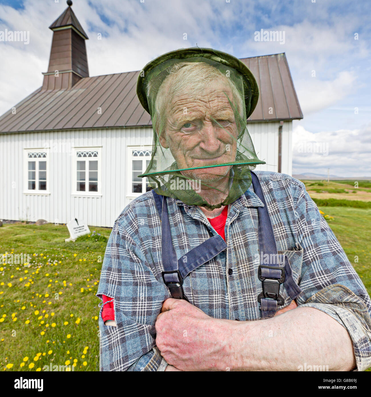 Portrait of a man wearing a head net, Strandakirkja Church, Reykjanes Peninsula, Iceland Stock Photo