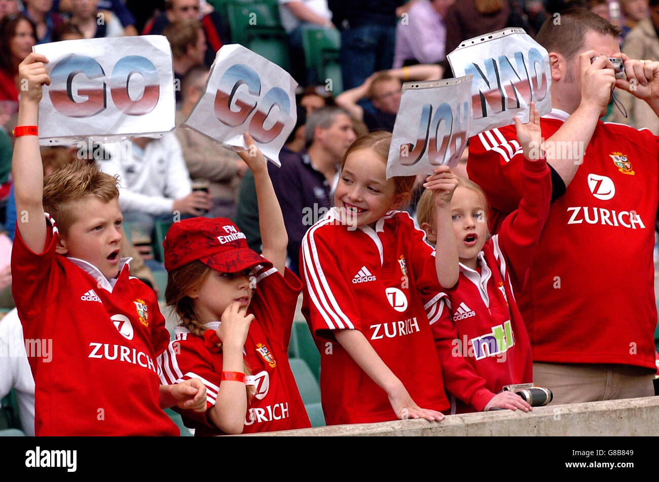 (l-r) Jack Lally, 9, Natalie Turner, 9, her sister Nicole, 7, and Jack's sister Grace, 7, all from Aldershot in Hampshire, cheer Martin Johnson before the match between a Martin Johnson XV and a Jonah Lomu XV in the Nobok Challenge match. Stock Photo