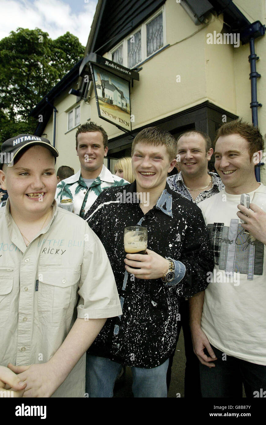 Ricky Hatton relaxes with friends outside his local pub The New Inn, in