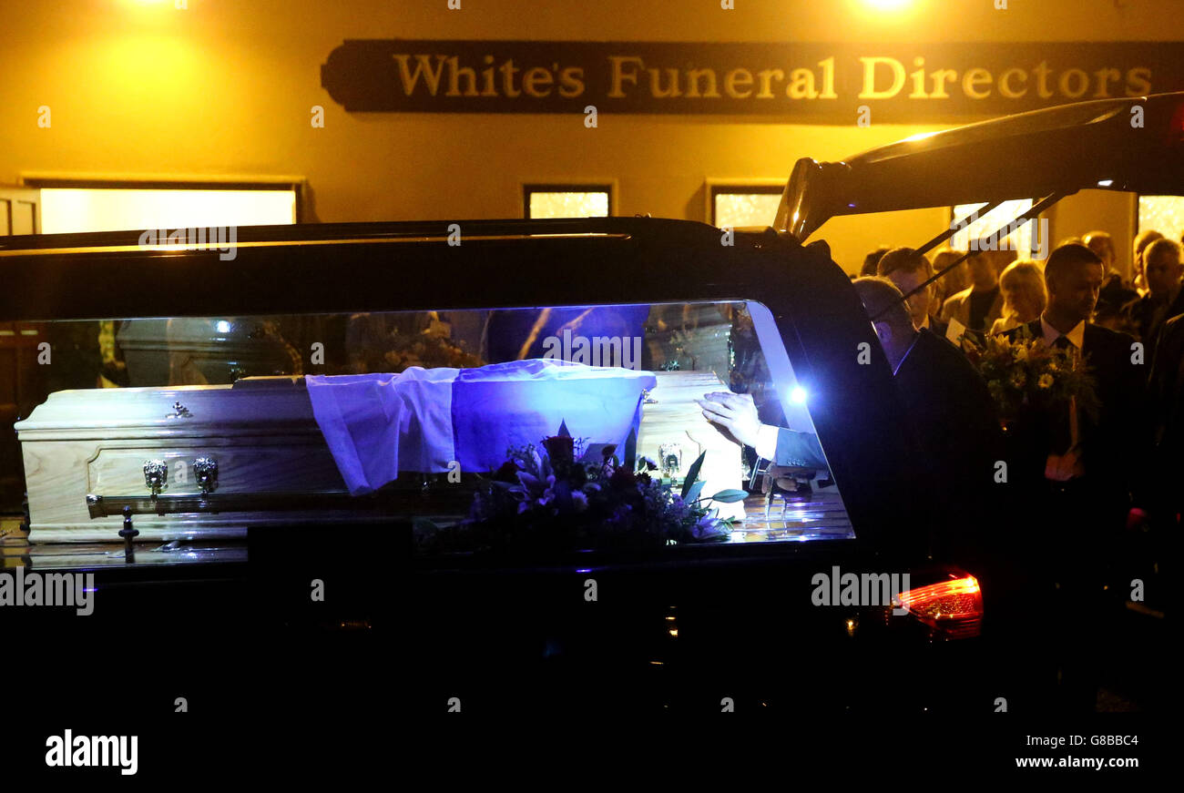 The coffin of Cathriona White, the ex-girlfriend of Jim Carrey, is placed into a hearse outside White's Funeral Home, prior to being taken to Our Lady of Fatima Church, in Cappawhite, Co Tipperary, Ireland, White was found dead in a house in Sherman Oaks, California on September 28. Stock Photo