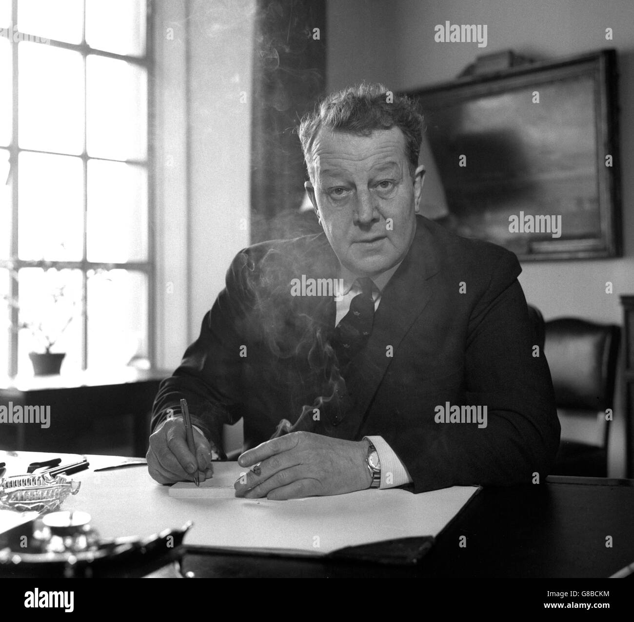 Wreathed in cigarette smoke hires stock photography and images Alamy