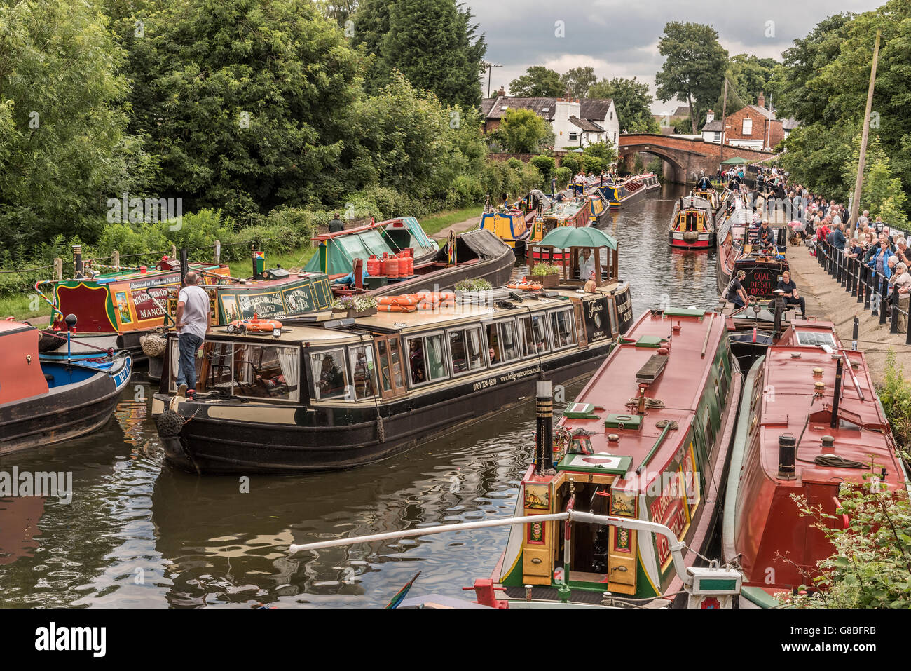 Vintage transport day at Lymm in Cheshire North West England. Parade of canal narrowboats on the Bridgewater. Stock Photo
