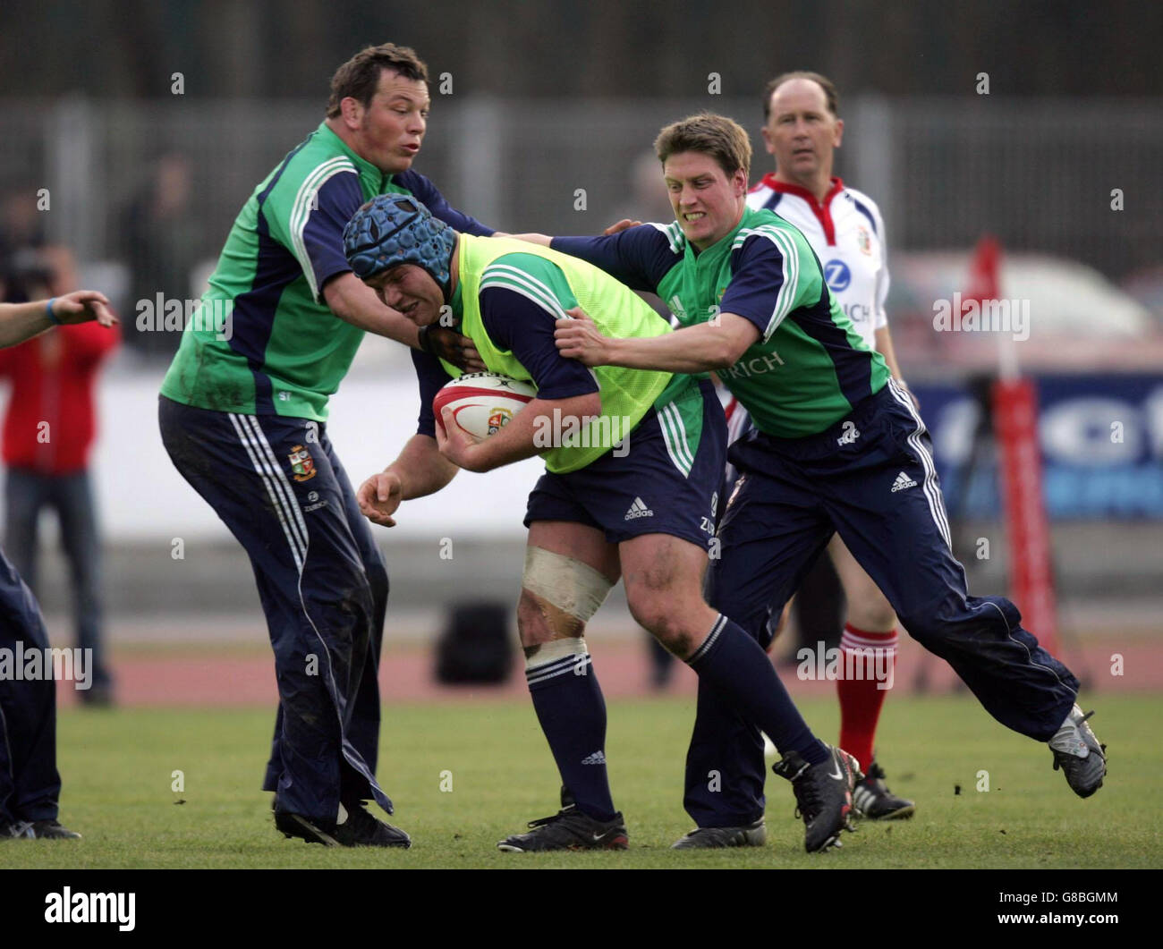 British & Irish Lion's Matt Stevens breaks through the tackles of Steve Thompson (L) and Ronan O'Gara (R). Stock Photo