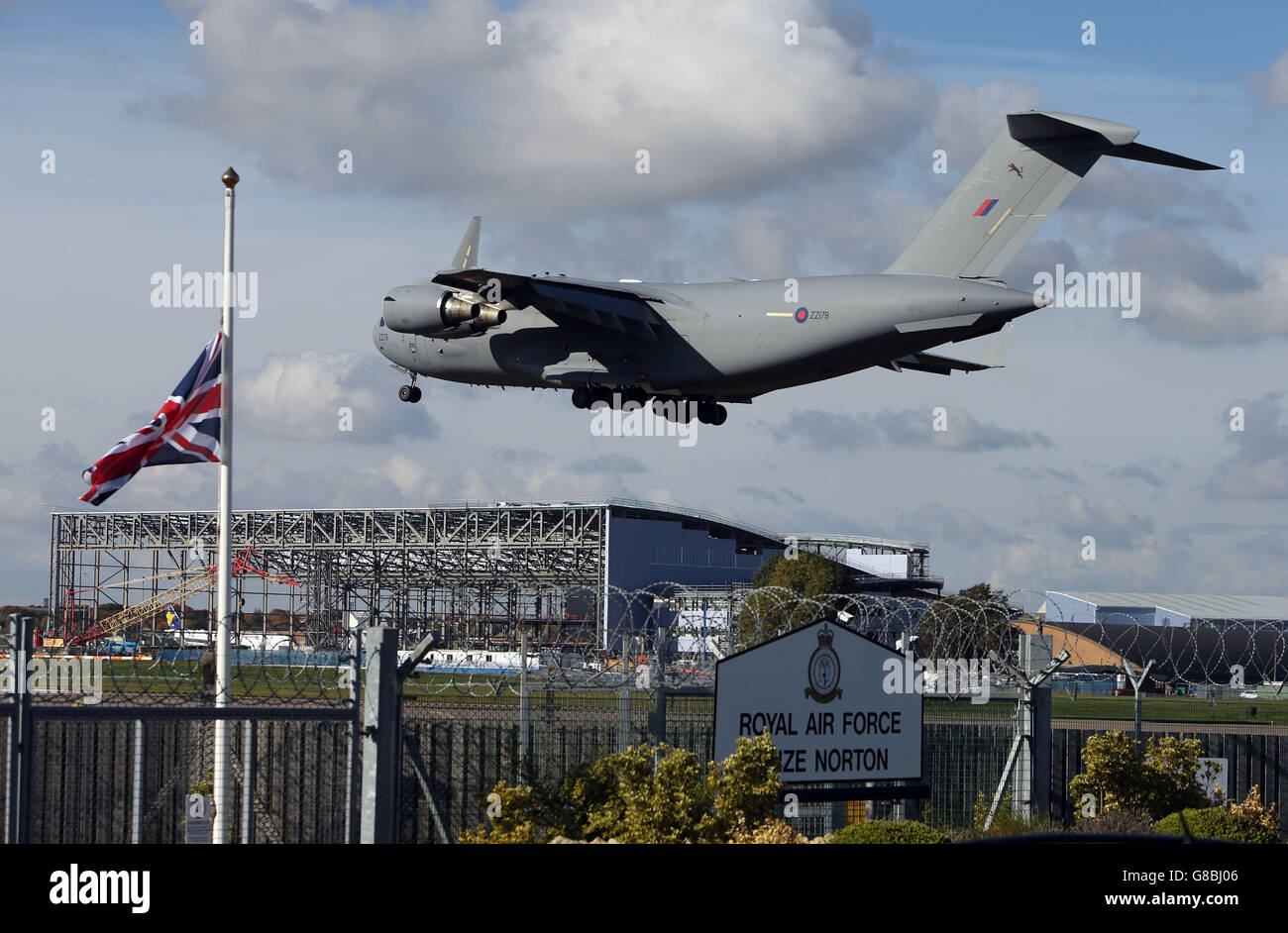 The RAF C-17 plane lands at RAF Brize Norton in Oxfordshire for the repatriation of Flight Lieutenant Alan Scott and Flight Lieutenant Geraint 'Roly' Roberts, who died after their Puma Mk 2 helicopter crashed while landing at Nato's Resolute Support mission headquarters in Kabul, Afghanistan. Stock Photo
