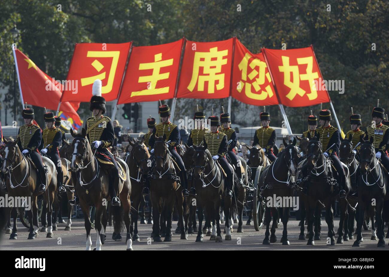 Members of the cavalry along The Mall in London during a ceremonial welcome for the Chinese President Xi Jinping and his wife Peng Liyuan on the first day of their state visit to the UK. Stock Photo