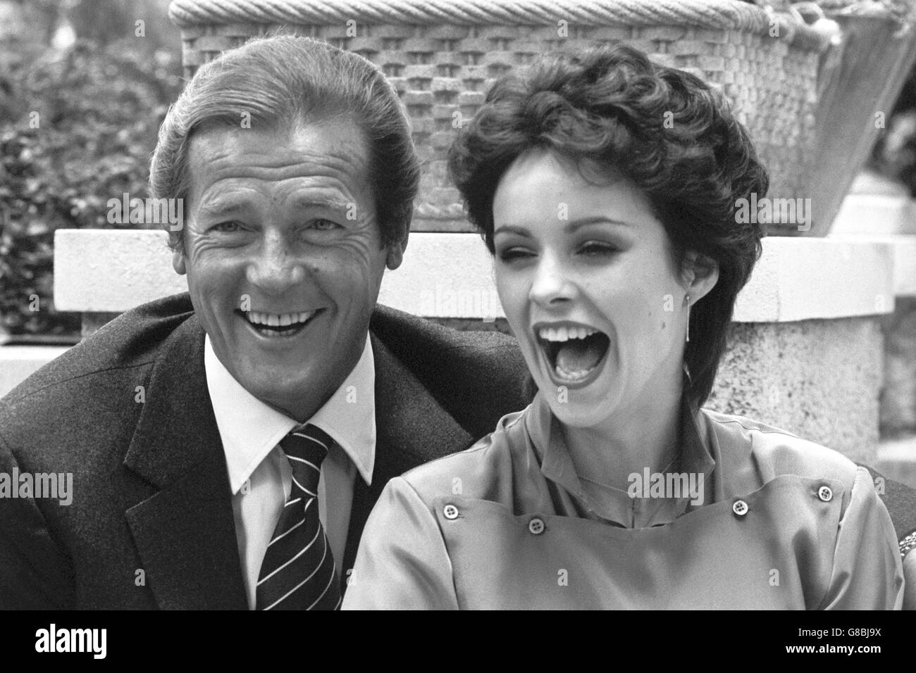 Roger Moore with Sheena Easton in London today. Sheena sings the theme song to the new James Bond film For Your Eyes Only, which opens in London tomorrow night. Moore makes his fifth appearance as Bond in the film. Stock Photo