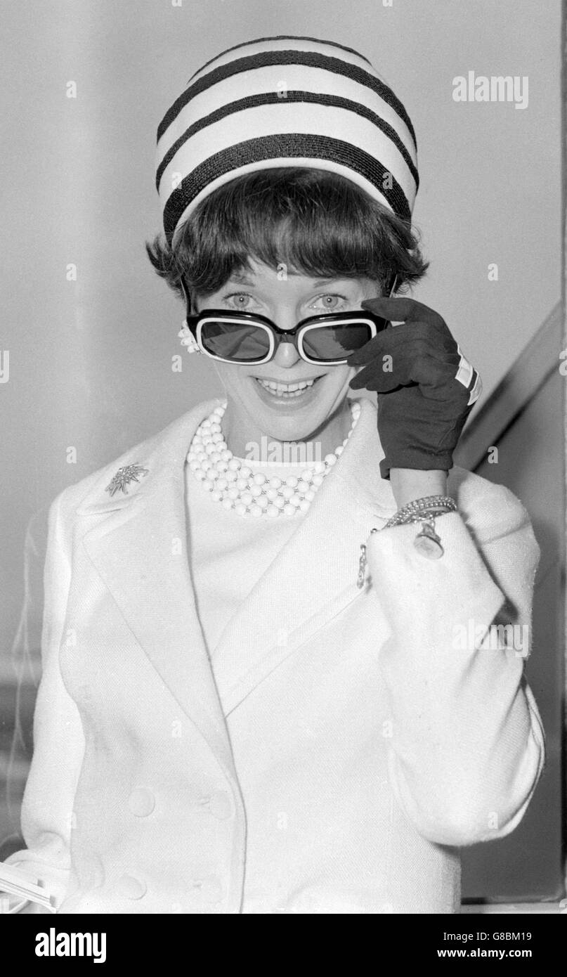 Black and white hat, sunglasses and gloves worn by actress Dawn Addams at London Airport. Stock Photo