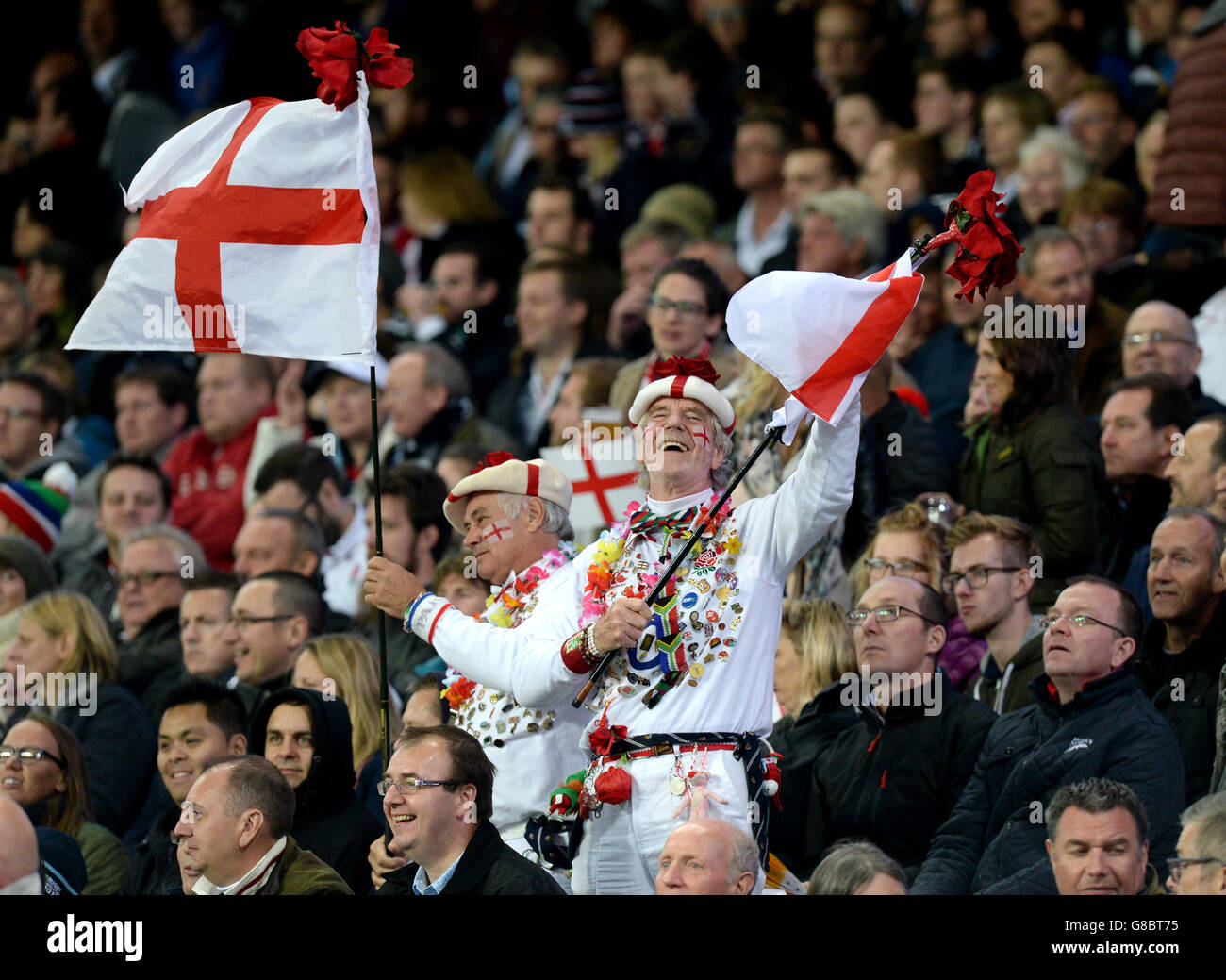 Rugby Union - Rugby World Cup 2015 - Pool A - England v Uruguay - City of Manchester Stadium. England fans wave flags in the stands during the Rugby World Cup match at the City of Manchester Stadium. Stock Photo