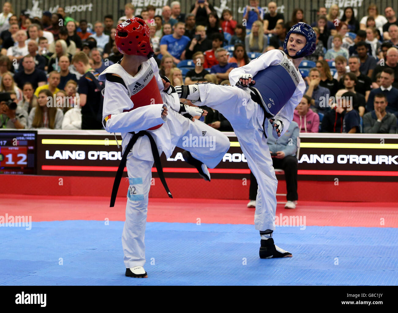 Great Britain's Max Cater (right) in action against Belgium's Si Mohamed Ketbi during their Men's -58 round of 16 match during day two of the WTF World Taekwondo Championships at Manchester Regional Arena. Stock Photo