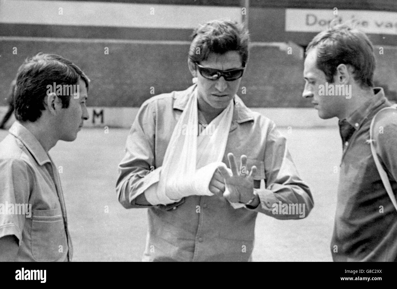 Soccer - World Cup England 1966 - Chile Training - Ayresome Park. Chile goalkeeper Adan Godoy (c) sports a cast and sling as he explains his injuries to teammates Stock Photo