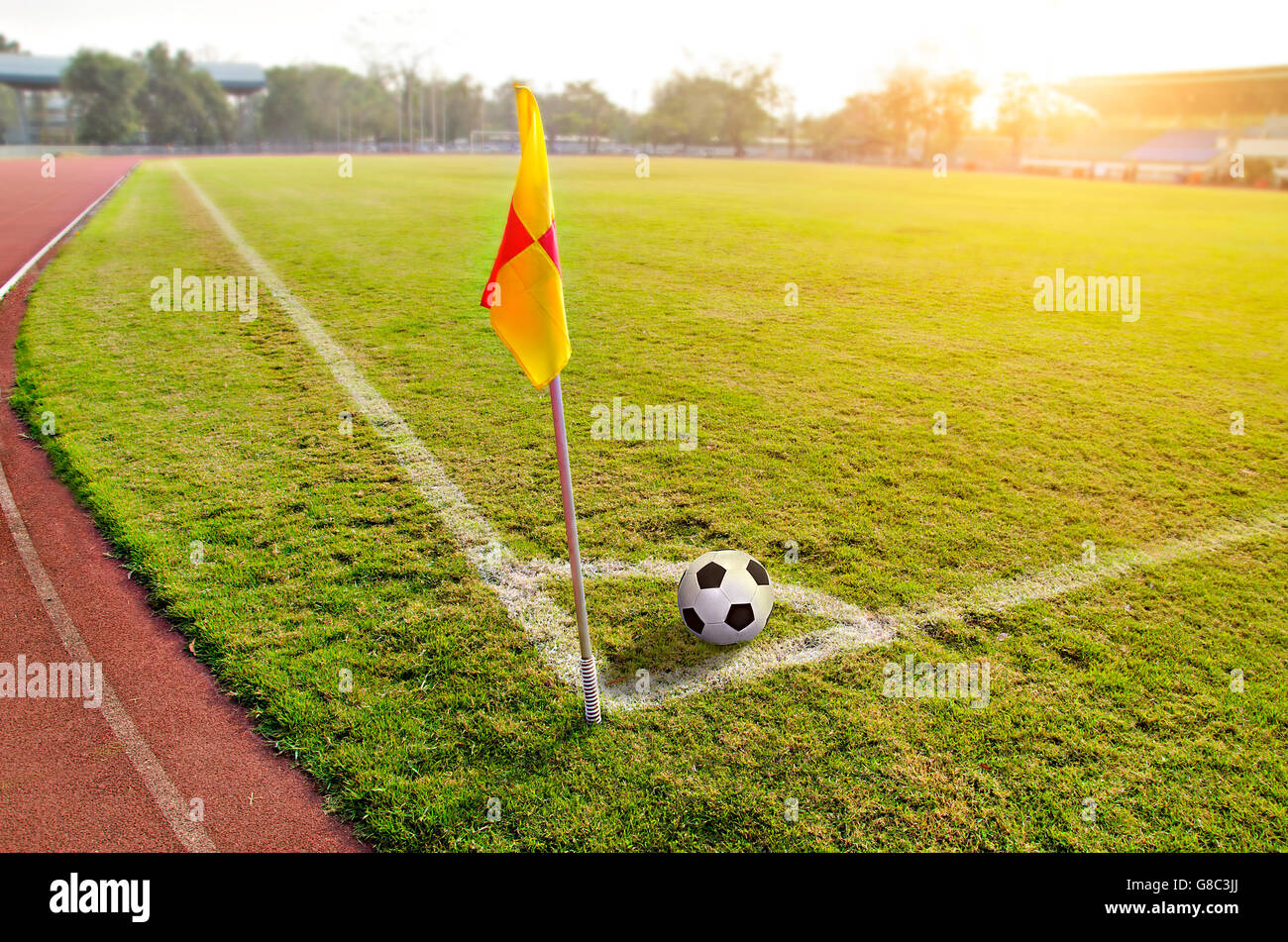 Corner flag with ball on a soccer field Stock Photo Alamy