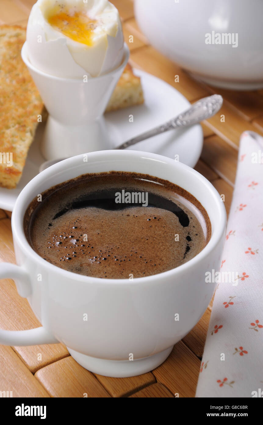 https://c8.alamy.com/comp/G8C6BR/a-cup-of-coffee-with-a-soft-boiled-egg-and-toast-for-breakfast-G8C6BR.jpg