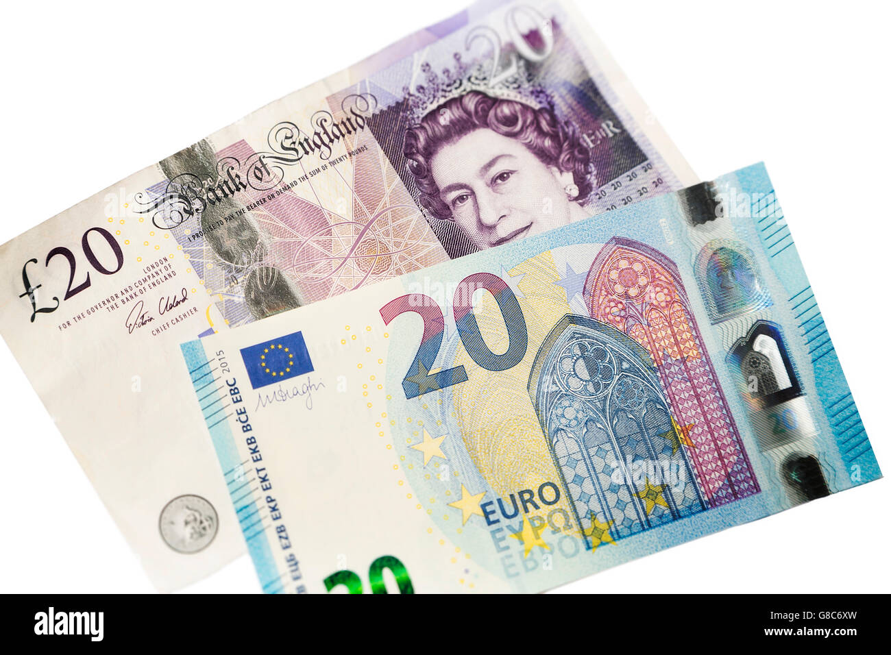 British European exit (Brexit) concept of twenty Euro and Pound note isolated on a white background Stock Photo