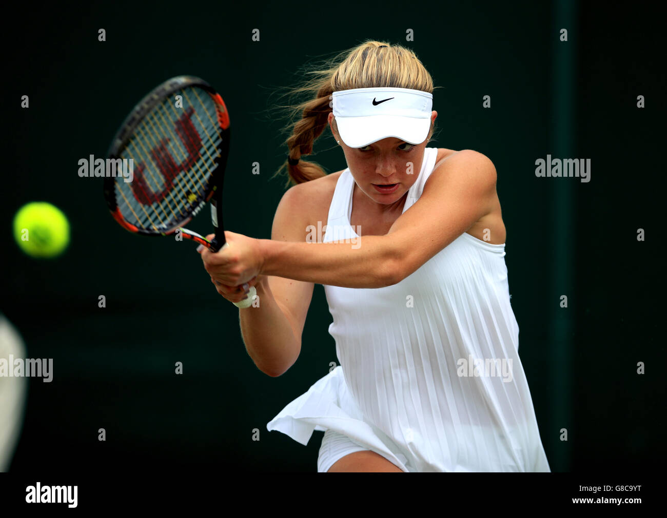 Katie Swan in action against Timea Babos on day Two of the Wimbledon Championships at the All England Lawn Tennis and Croquet Club, Wimbledon. Stock Photo