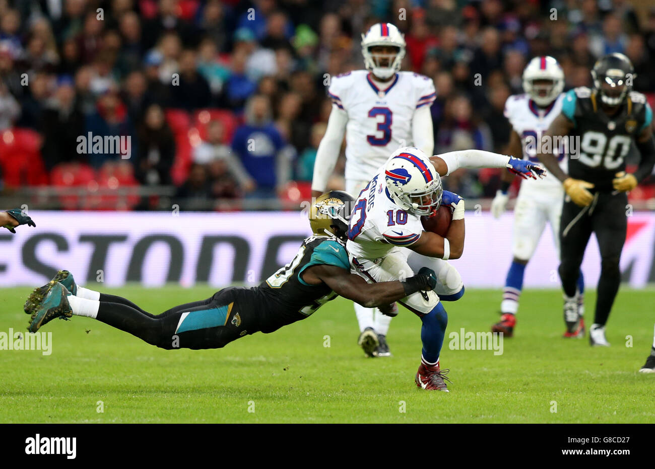 Buffalo Bills' Robert Woods (right) is tackled by Jacksonville Jaguars' Telvin Smith during the NFL International match at Wembley Stadium, London. Stock Photo