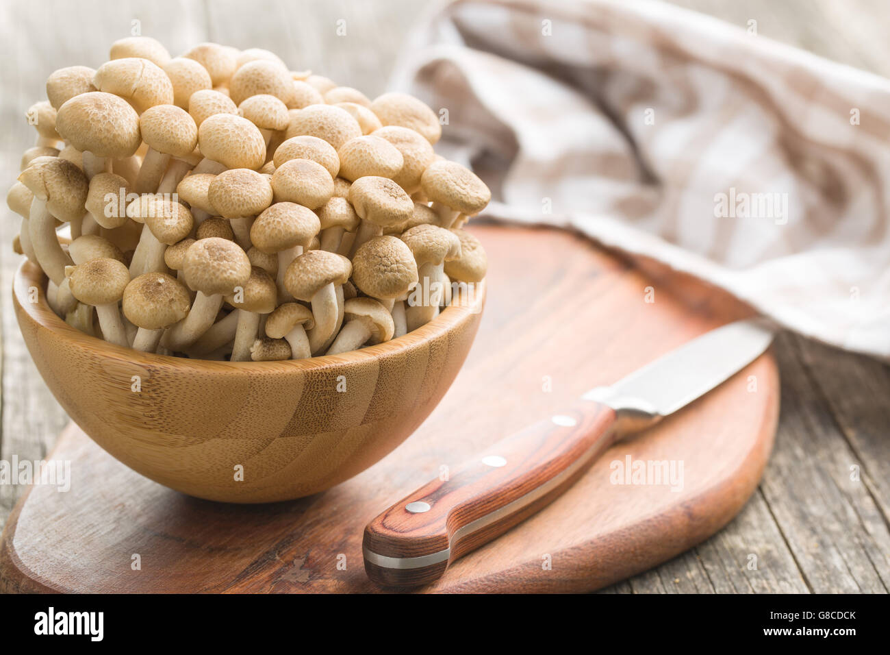 Brown shimeji mushrooms. Healthy superfood in wooden bowl Stock Photo