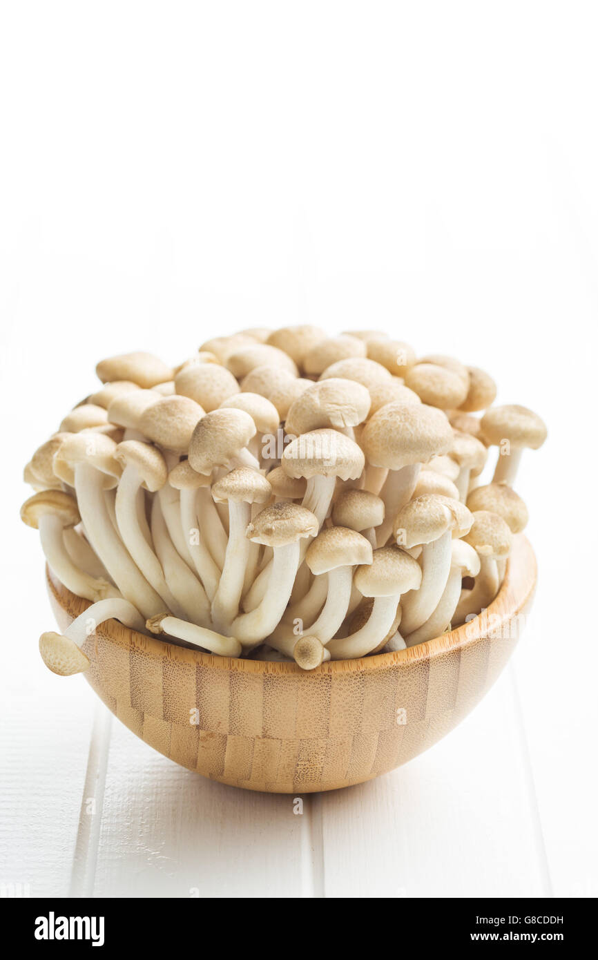 Brown shimeji mushrooms. Healthy superfood in wooden bowl Stock Photo