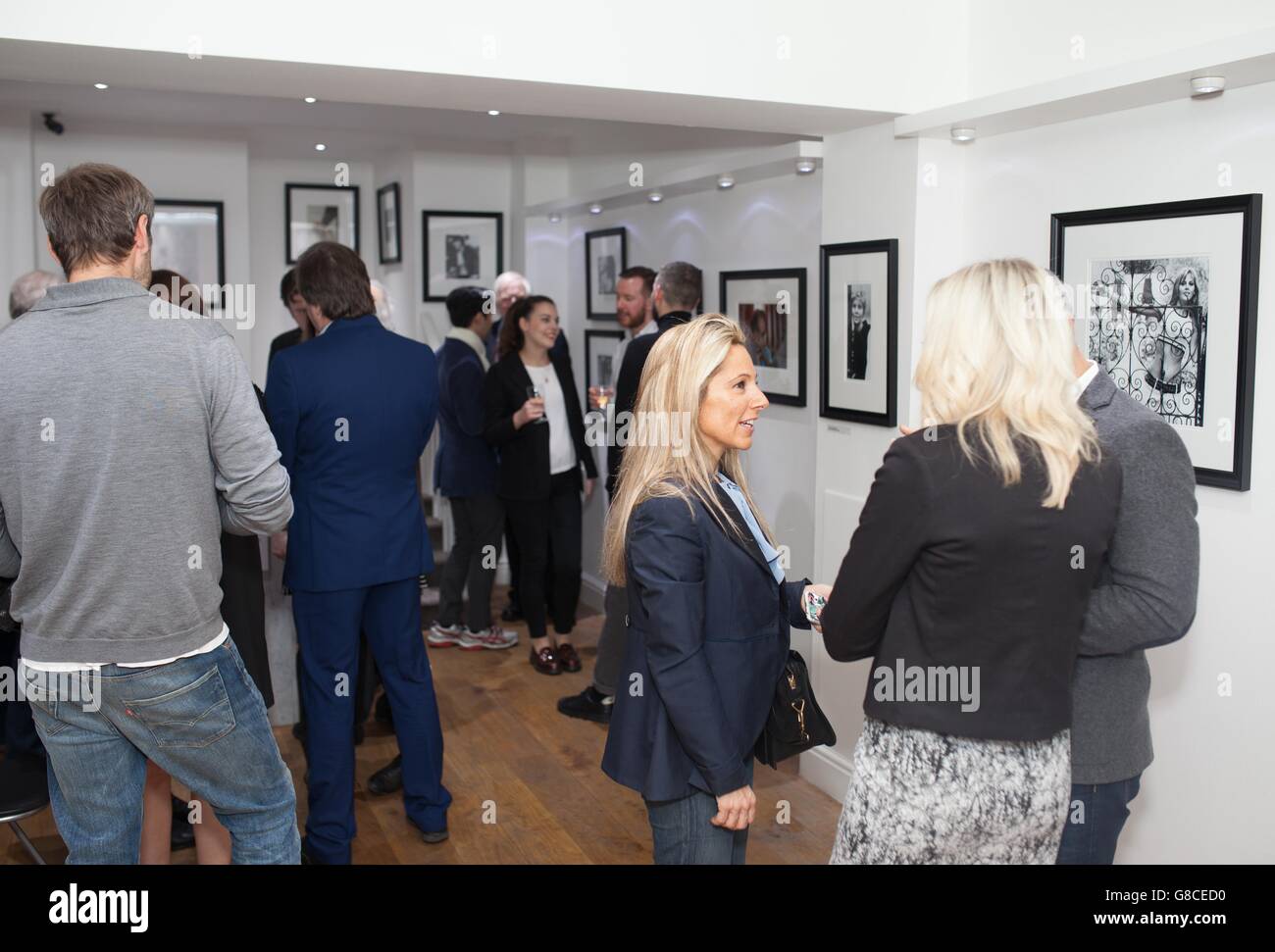 Guests at the photography exhibition 'Peter Sellers: Behind the Camera', to raise money for the British Heart Foundation in Kensington, London. Stock Photo