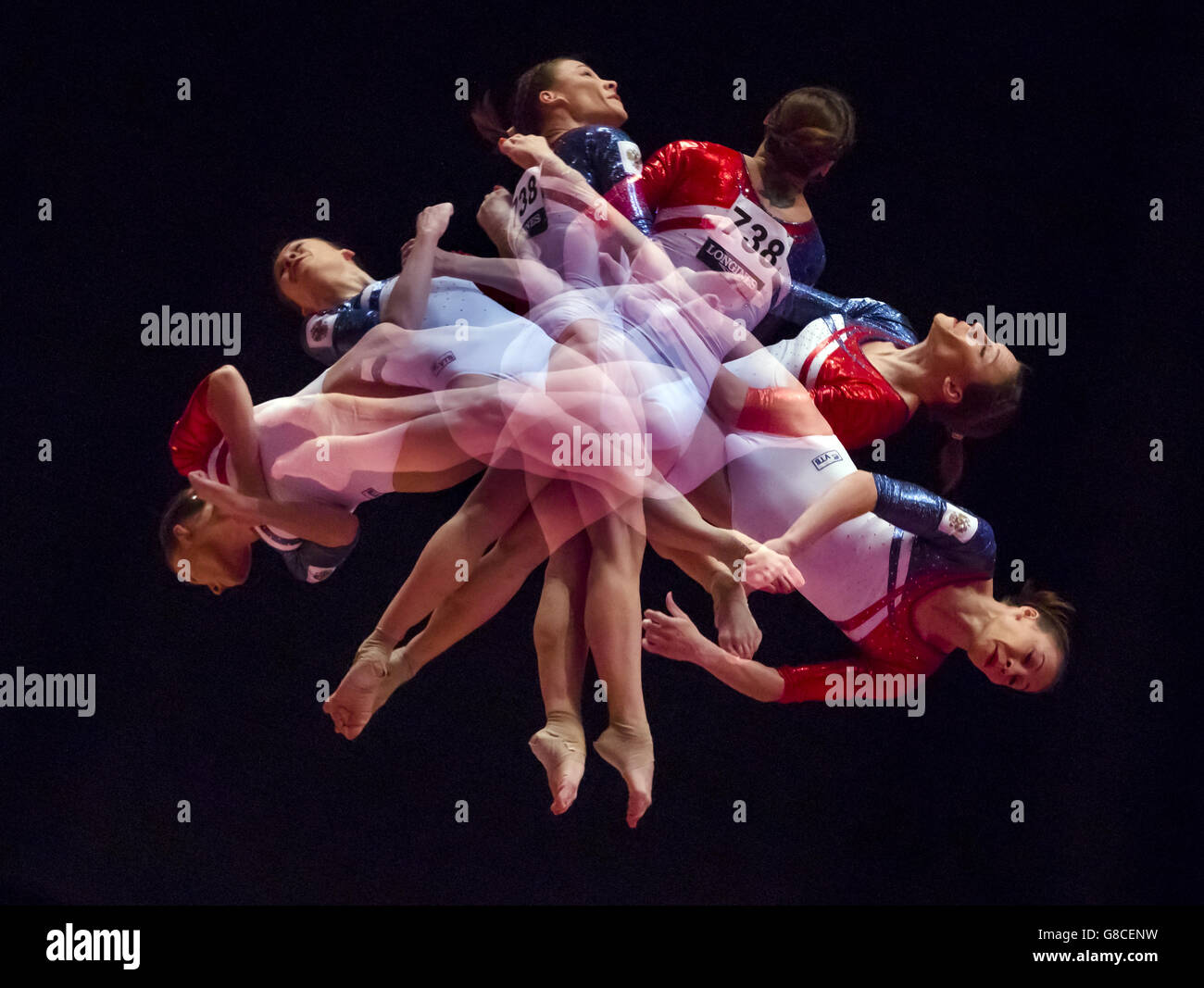 Multiple exposure created in camera of Russia's Kseniia Afanaseva competes on the Vault Table during day five of the 2015 World Gymnastic Championships at The SSE Hydro, Glasgow. Stock Photo