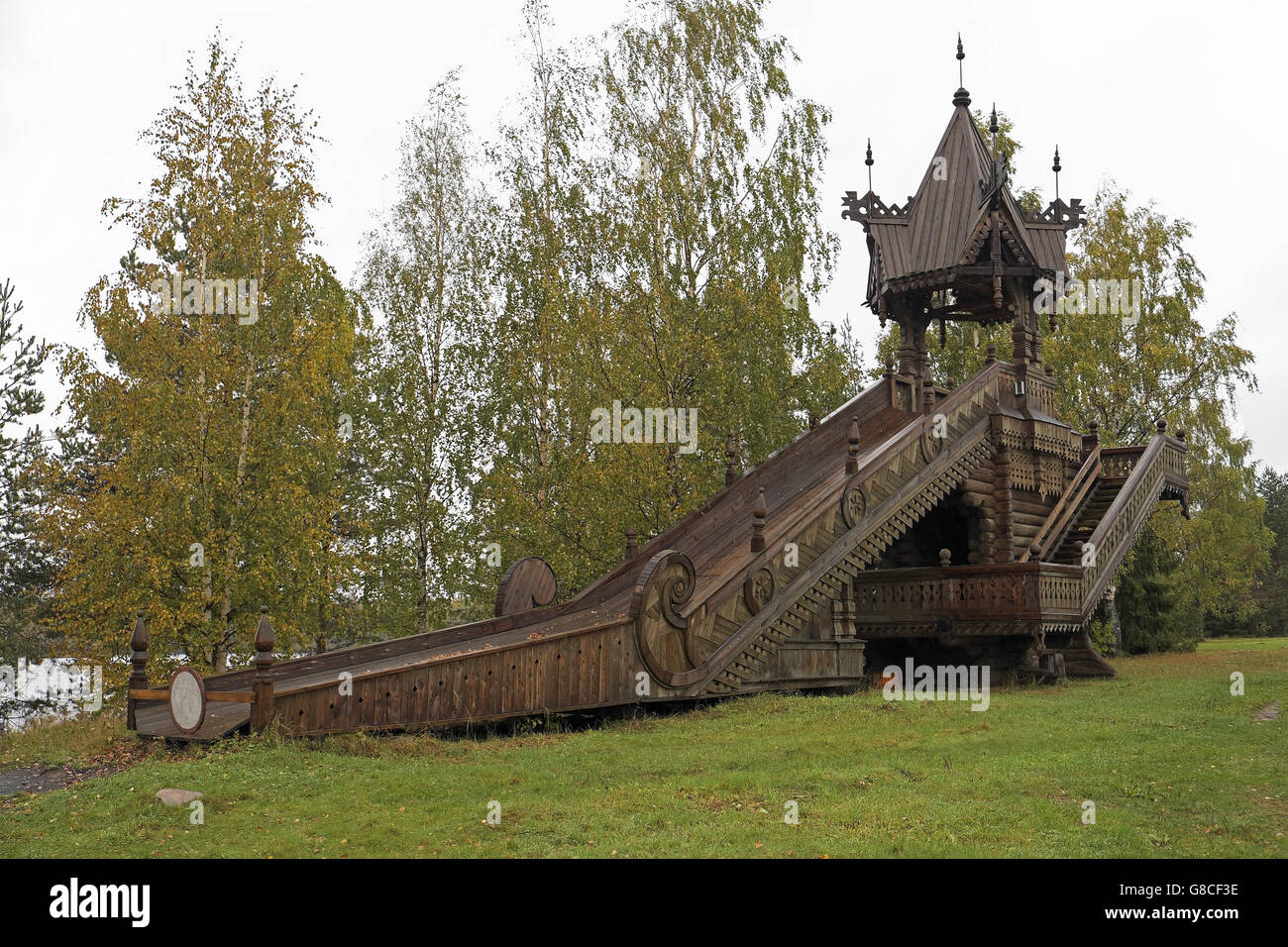 Ornately carved wooden slide, Mandrogy (on Svir River to the east of St Petersburg), Russia. Stock Photo
