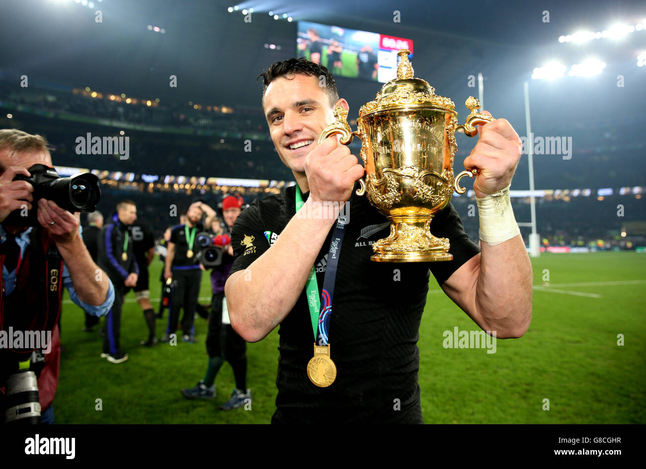 New Zealand's Dan Carter celebrates with the Webb Ellis Cup after the Rugby World Cup Final at Twickenham, London. Stock Photo