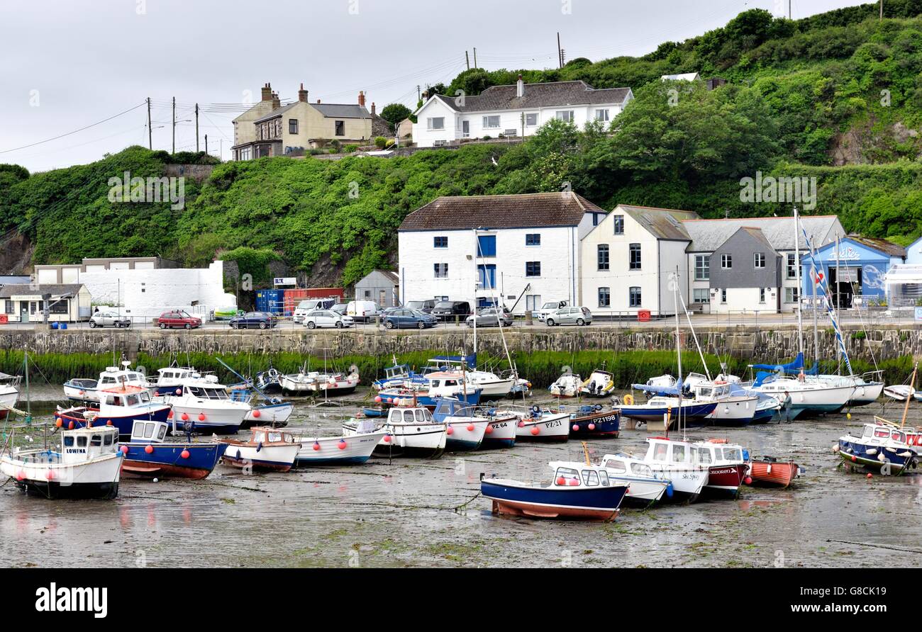 Boats in Porthleven Harbour at low tide Cornwall England UK Stock Photo