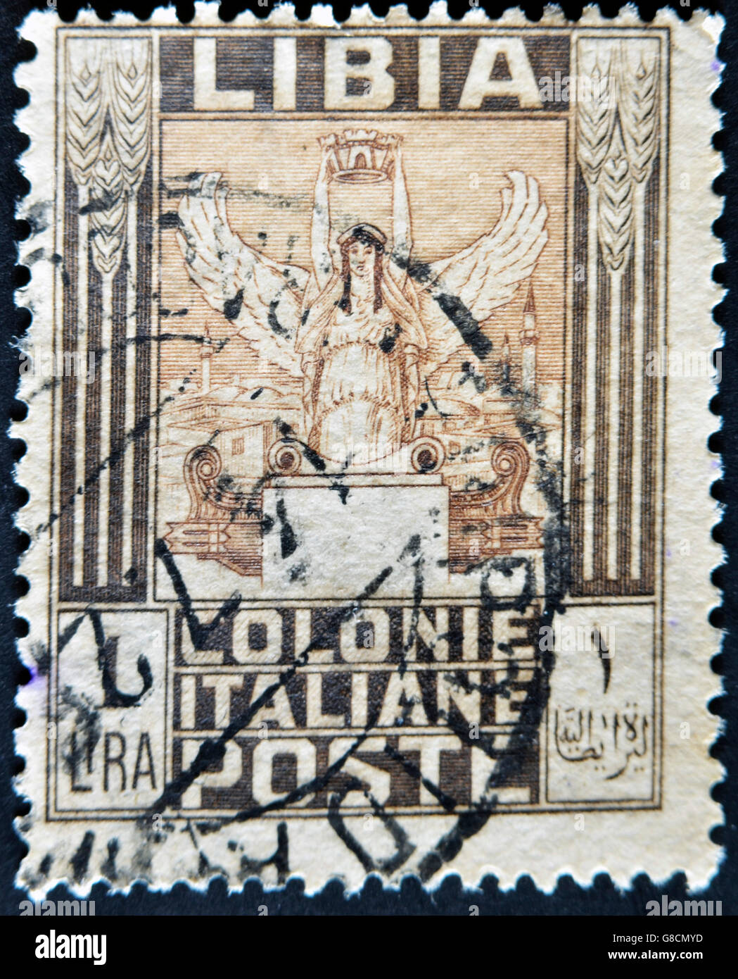 LIBYA - CIRCA 1940: A stamp printed in Italian colony of Libya shows sculpture of winged woman with a crown, circa 1940 Stock Photo
