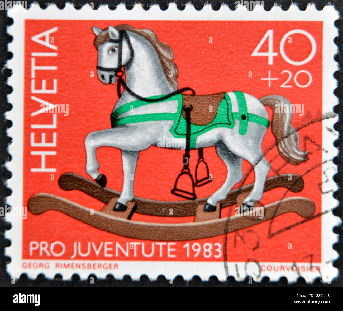 SWITZERLAND - CIRCA 1983: A stamp printed in Switzerland shows a wooden horse, circa 1983 Stock Photo
