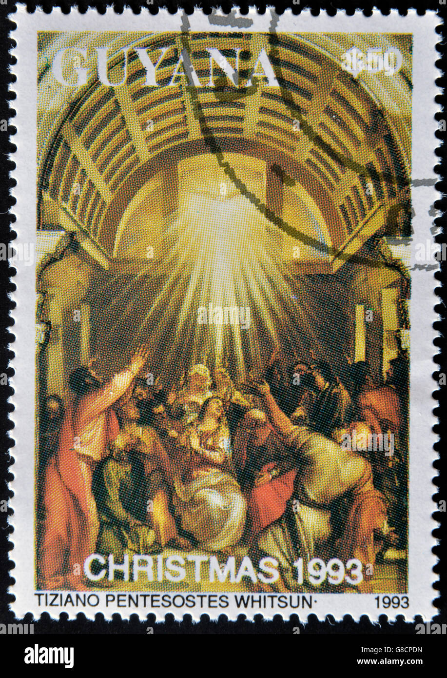 GUYANA - CIRCA 1993: A stamp printed in Guayana shows Pentecost by Tiziano, circa 1993 Stock Photo