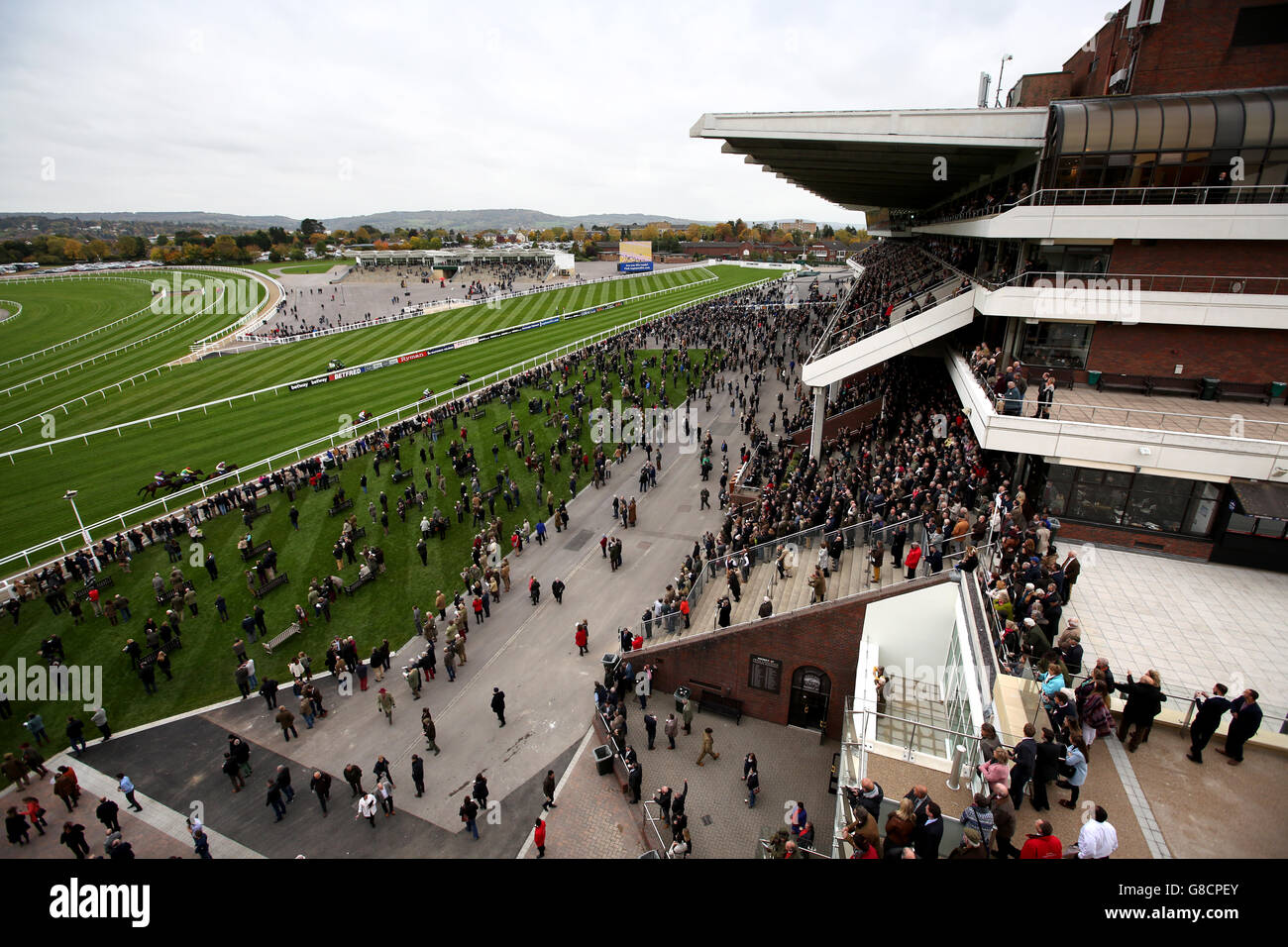 Horse Racing - The Showcase - Day One - Cheltenham Racecourse. A general view across the course from the balcony of the Princess Royal Grandstand as racegoers watch the runners and riders Stock Photo