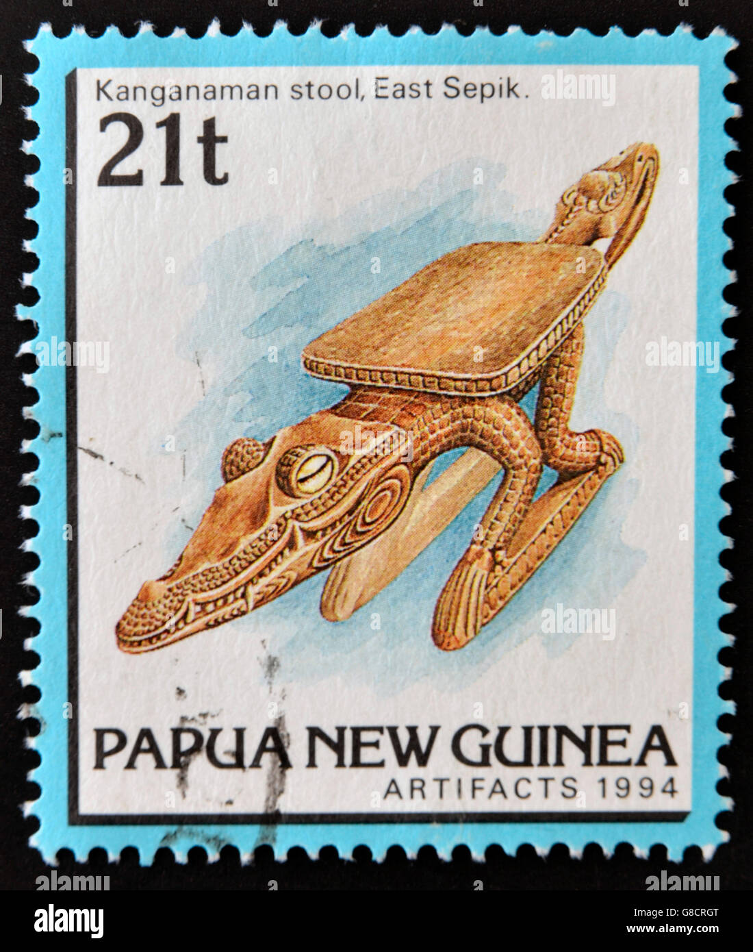 PAPUA NEW GUINEA - CIRCA 1994: A stamp printed in Papua shows Kanganaman stool, east spik, circa 1994 Stock Photo