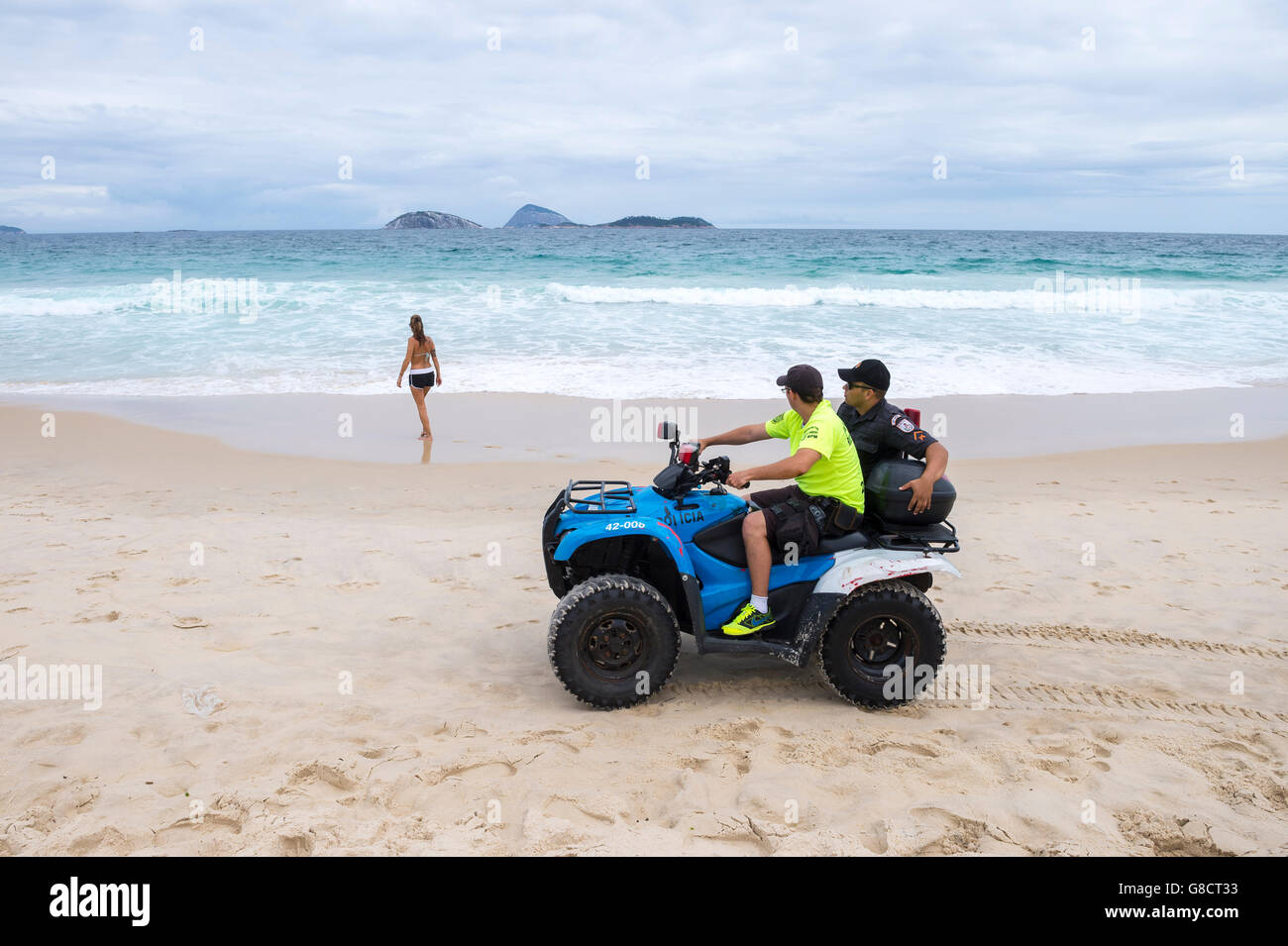 RIO DE JANEIRO - MARCH 15, 2016: Police on quad bike patrol Ipanema Beach as the city tries to improve security for the Olympics Stock Photo