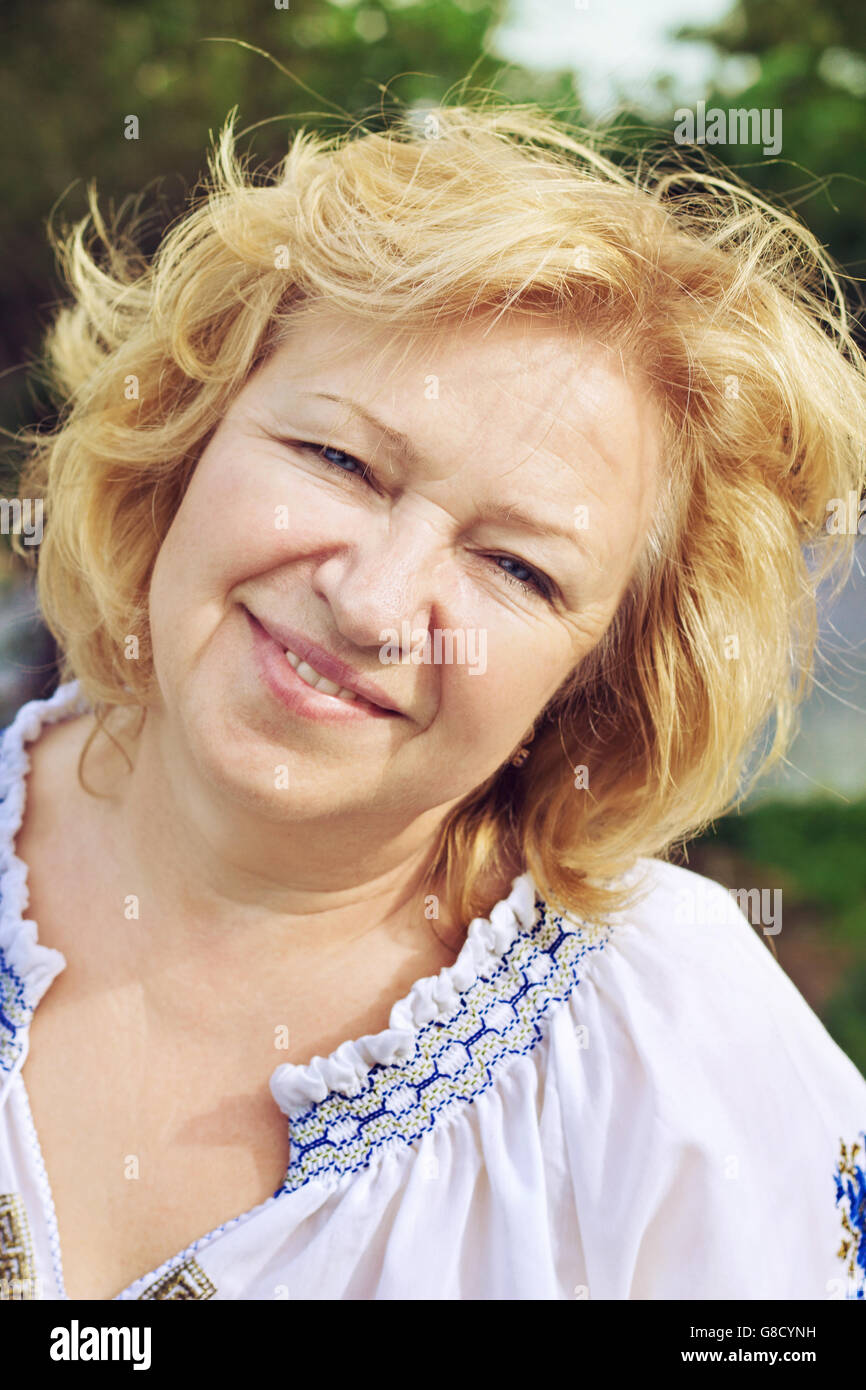 Attractive middle aged blonde woman hi-res stock photography and images