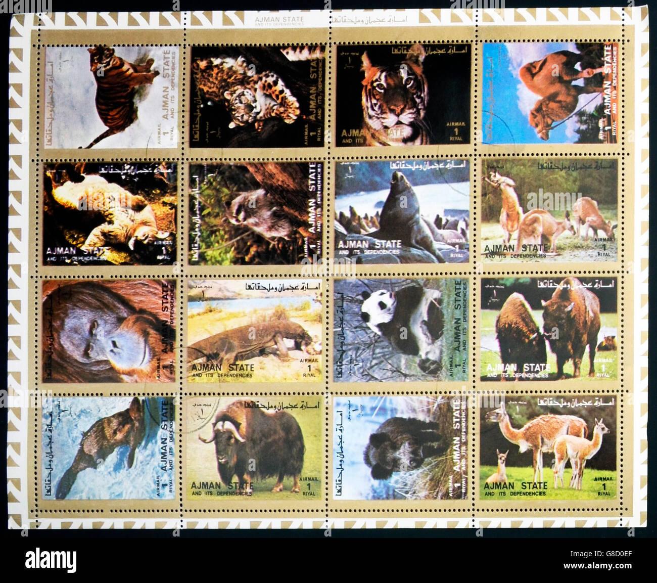 AJMAN- CIRCA 1972: A collection of sixteen stamps showing pictures of endangered animals, circa 1972 Stock Photo
