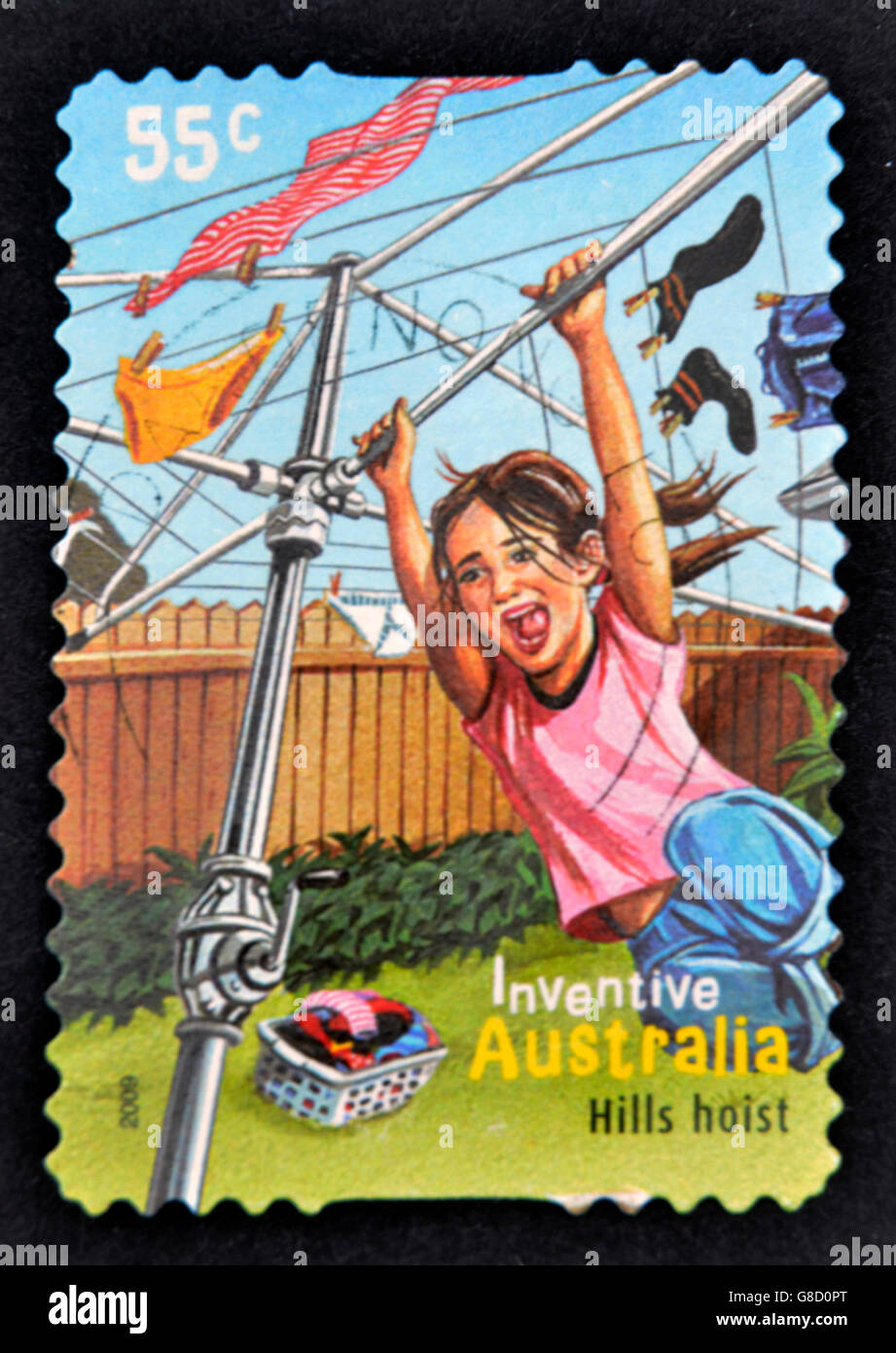 AUSTRALIA - CIRCA 2009: A stamp printed in Australia shows a girl playing on a clothesline as a hills hoist, inventive, circa 20 Stock Photo