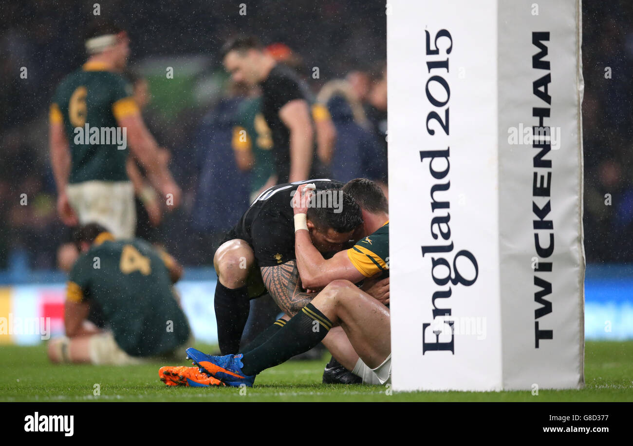 South Africa's Jesse Kriel sits dejected as he is embraced by New Zealand's Sonny Bill Williams after the Rugby World Cup, Semi Final at Twickenham Stadium, London. Stock Photo