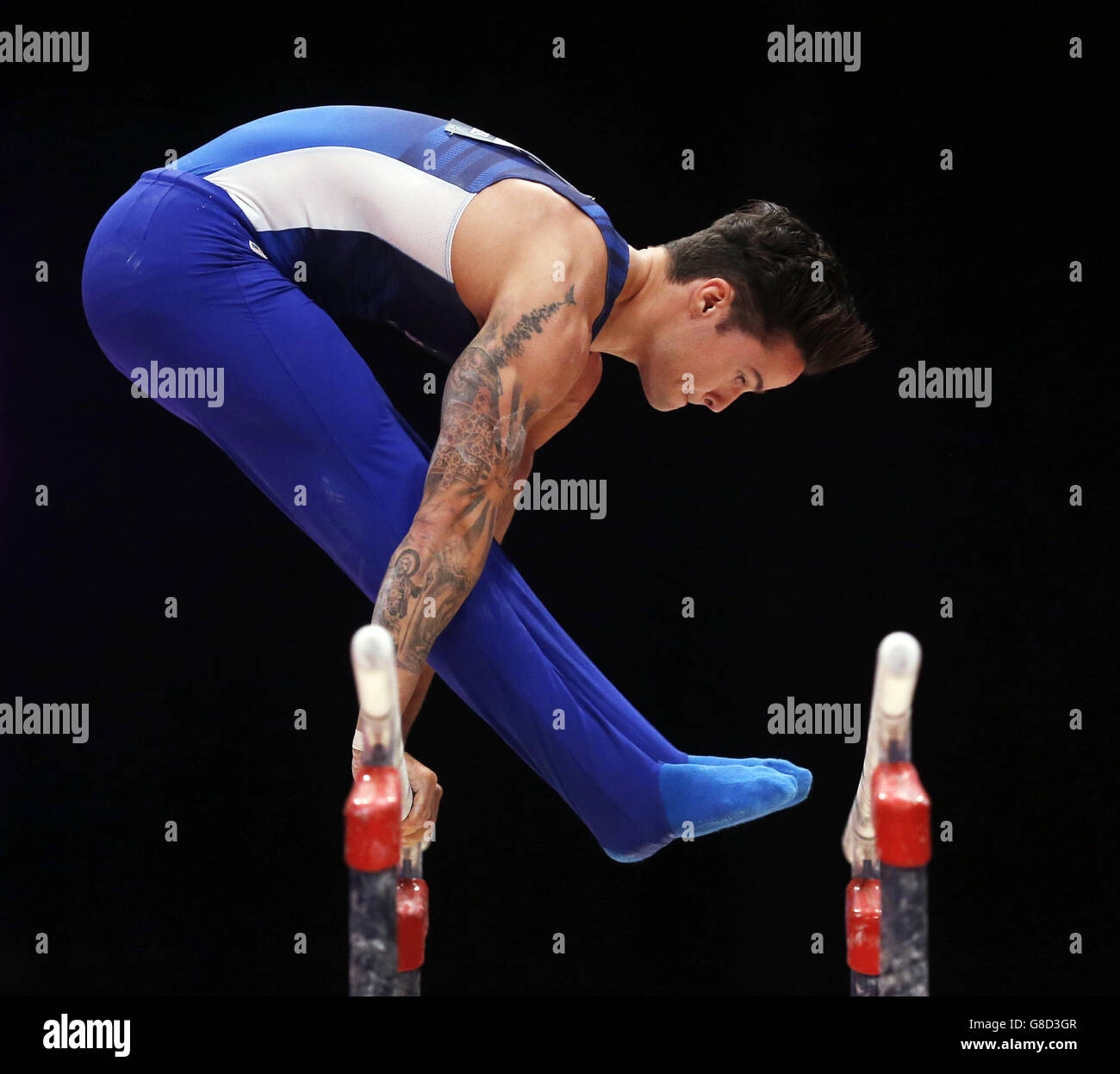 USA's Paul Ruggeri III competes on the Parallel Barsduring day four of the 2015 World Gymnastic Championships at The SSE Hydro, Glasgow. Stock Photo
