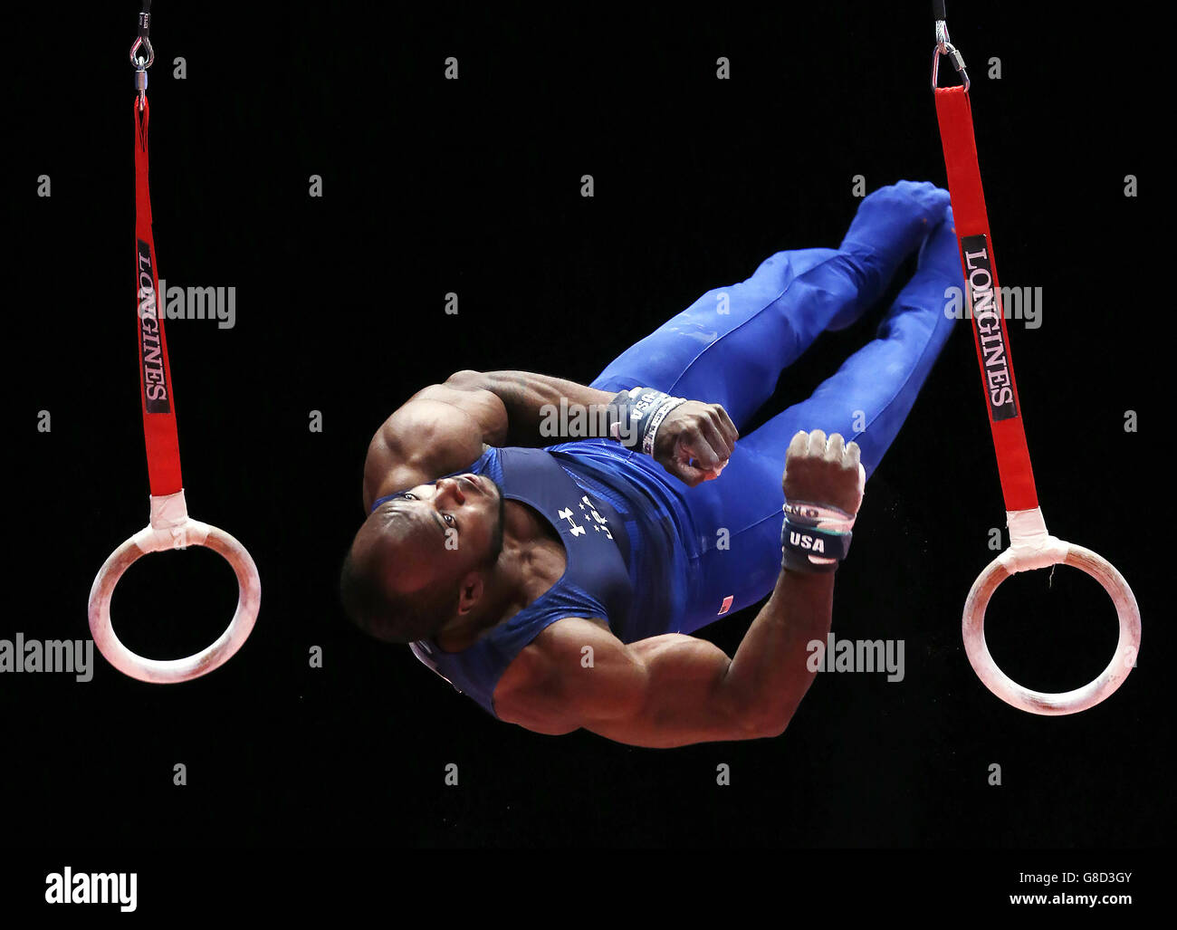 USA's Donnell Whittenburg dismounts after competing on the Still Rings during day four of the 2015 World Gymnastic Championships at The SSE Hydro, Glasgow. Stock Photo