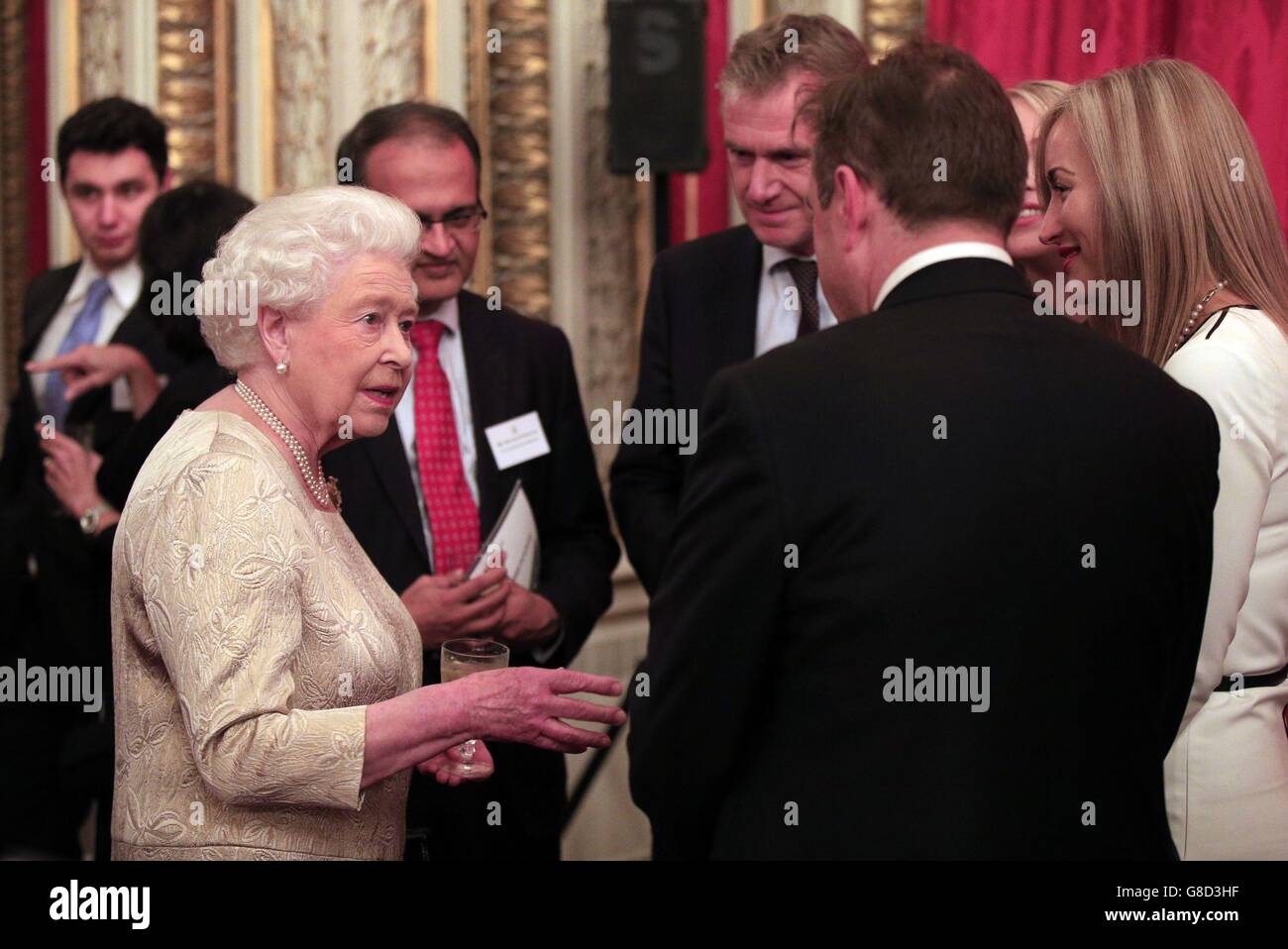 Reception Queen Queen Elizabeth II (left) speaks to guests during a reception for The ...