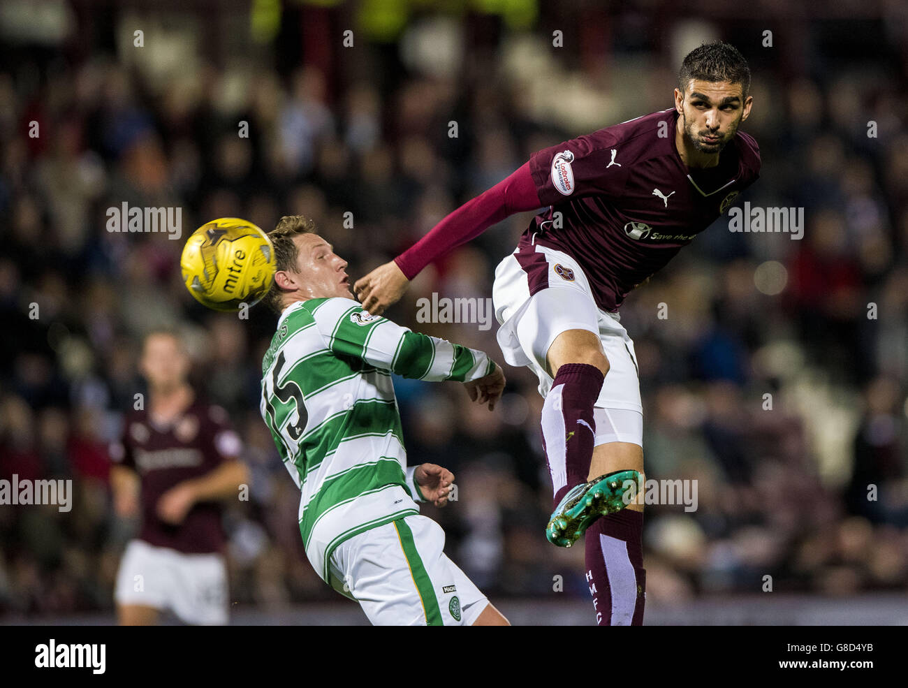 Celtic's Kris Commons and Hearts' Blazej Augustyn (right) compete for the ball during the Scottish Communities League Cup, Quarter Final at Tynecastle Stadium, Edinburgh. Stock Photo